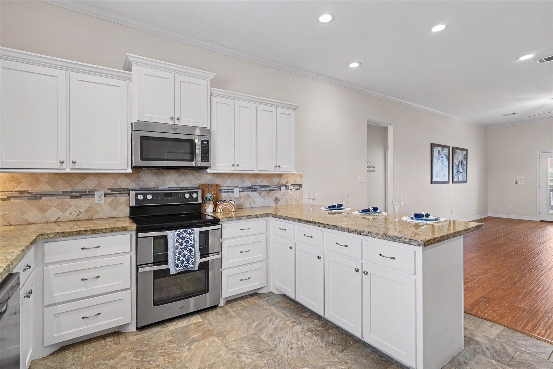 437 Pompano Street, Bayou Vista, TX 77563 The kitchen's vastness ensures that multiple cooks can work harmoniously, creating a dynamic and inviting atmosphere for culinary creativity. Boasting an open concept layout, it seamlessly connects to the dining and living areas, making it perfect for entertaining and family gatherings