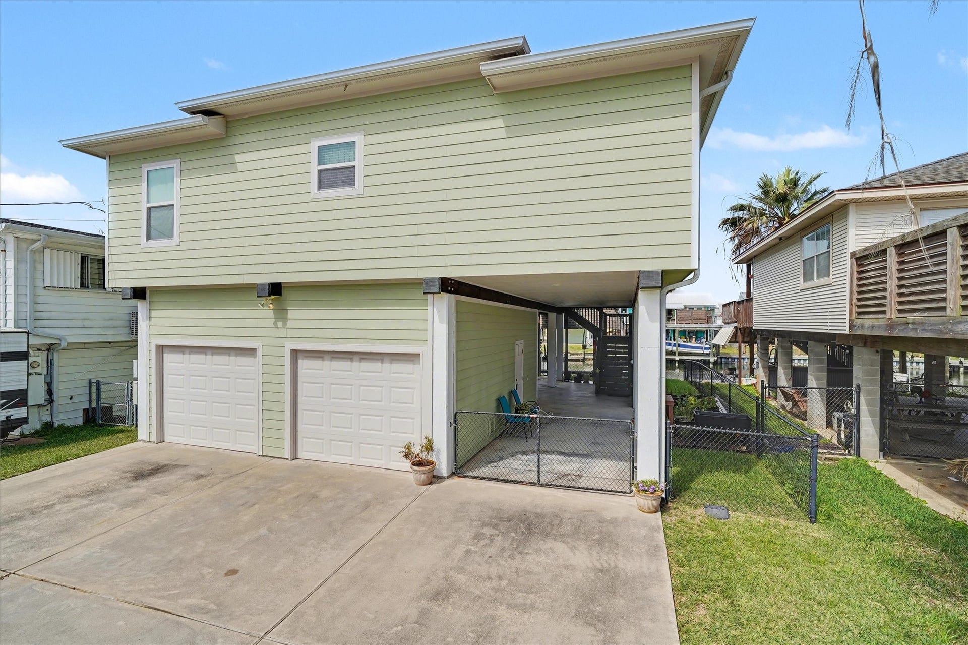 437 Pompano Street, Bayou Vista, TX 77563 Amazing home featuring oversized double garages, an open bay perfect for entertaining, and a fully fenced yard ideal for pets