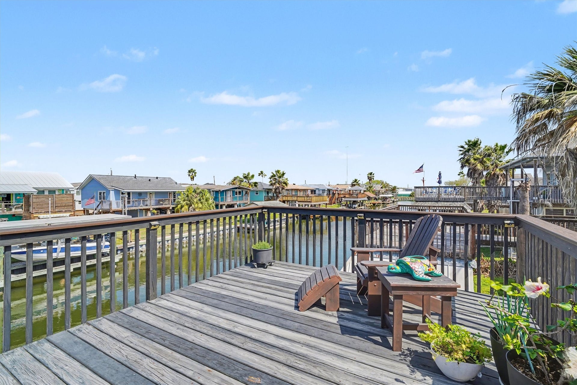 437 Pompano Street, Bayou Vista, TX 77563 Spacious upper party deck offering ample room for outdoor dining and comfortable lounging. Designed for both entertaining and relaxation, this inviting space captures the essence of coastal living with plenty of room to gather, dine, and unwind in style