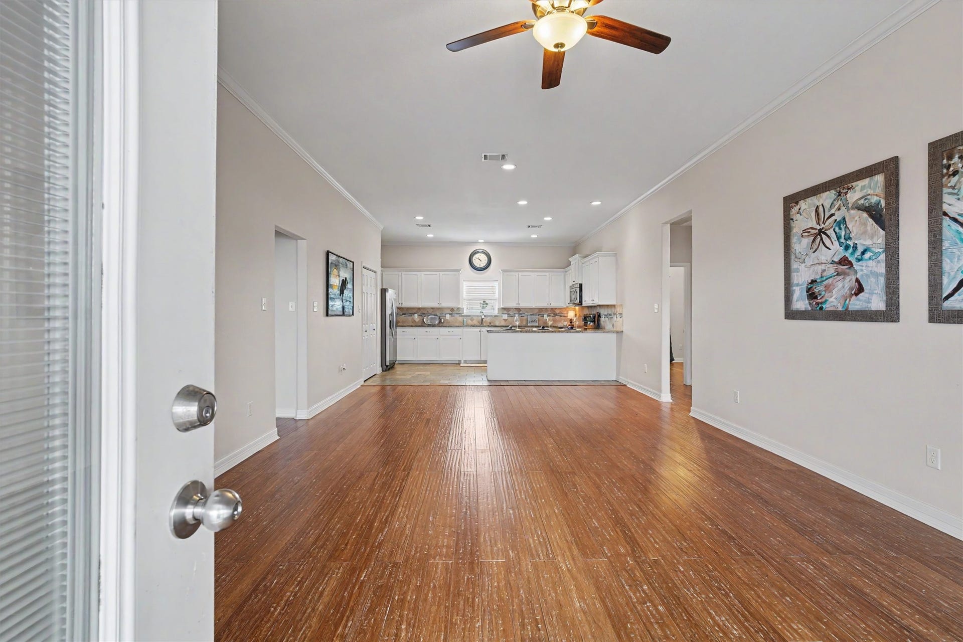 437 Pompano Street, Bayou Vista, TX 77563 As you walk through the french doors you immediately notice the coastal inspired bamboo flooring with "hand scraped" detailing