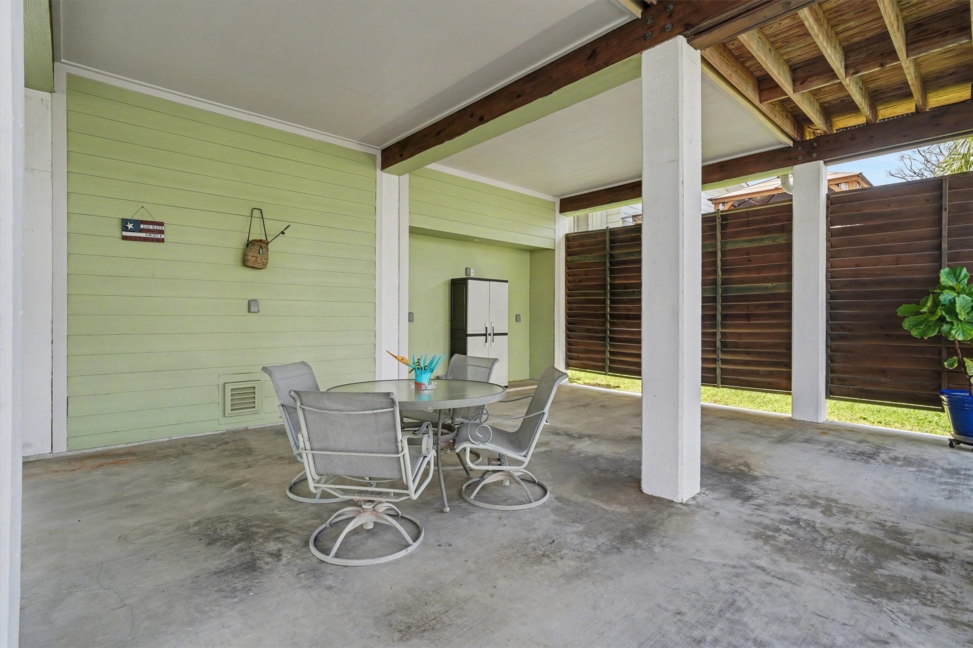 437 Pompano Street, Bayou Vista, TX 77563 Downstairs open area designed as the heart of waterfront living, offering generous space for outdoor dining and a large sectional sofa. Perfect for entertaining, relaxing, and enjoying the coastal breeze, this inviting space captures the essence of life by the water