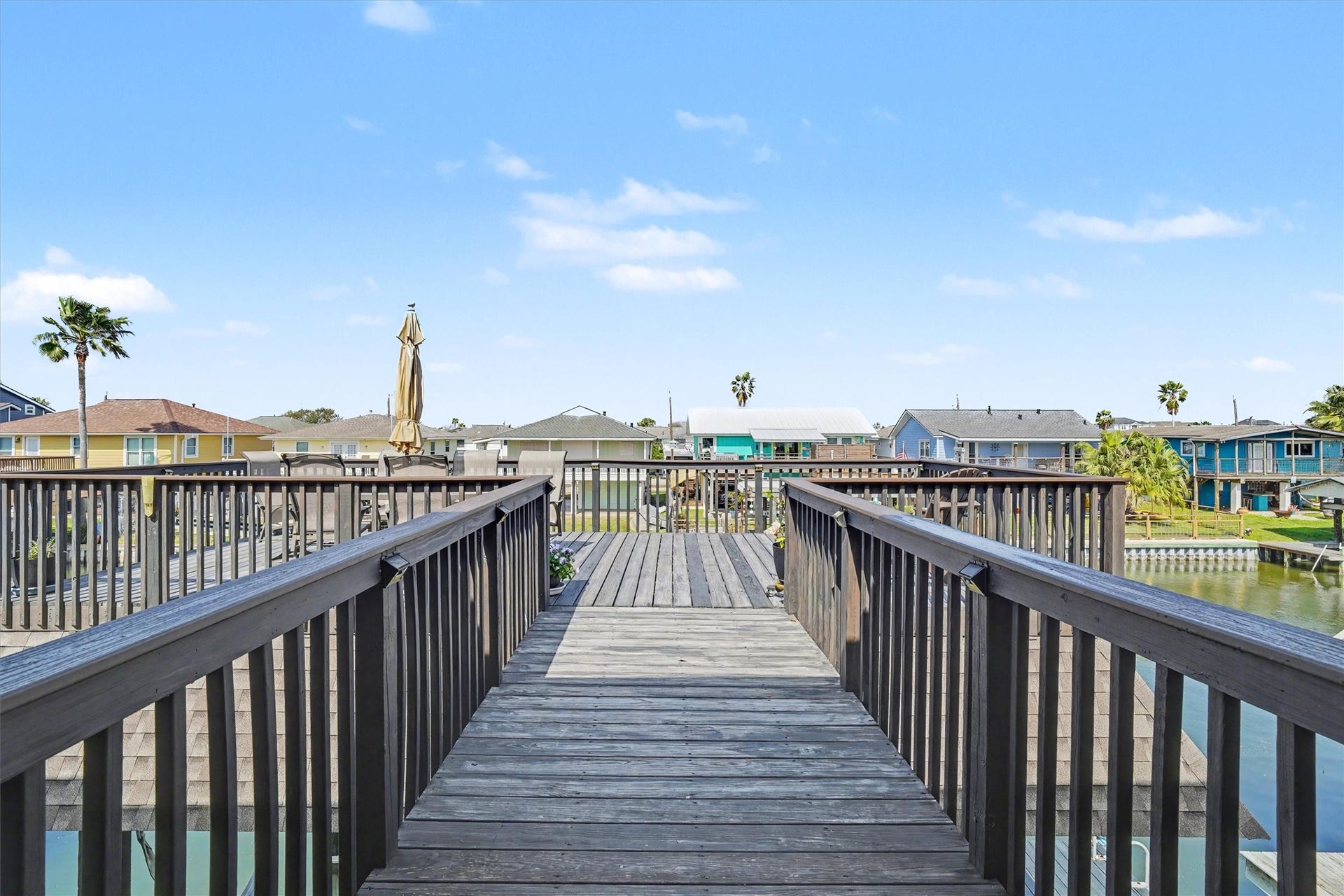 437 Pompano Street, Bayou Vista, TX 77563 Catwalk leads to the upper party deck, a vibrant space perfect for entertaining, outdoor dining, or quiet moments with a good book. Enjoy sweeping views and the peaceful sight of pelicans gliding byan ideal retreat for relaxation and coastal living
