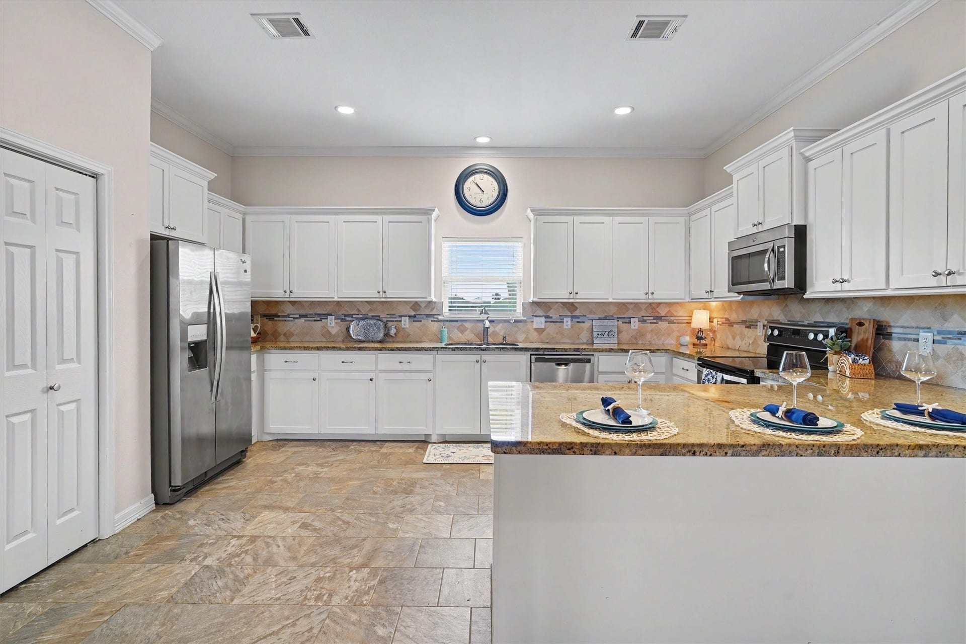 437 Pompano Street, Bayou Vista, TX 77563 With ample seating and a seamless flow into the dining and living areas, this kitchen is as functional as it is stylish