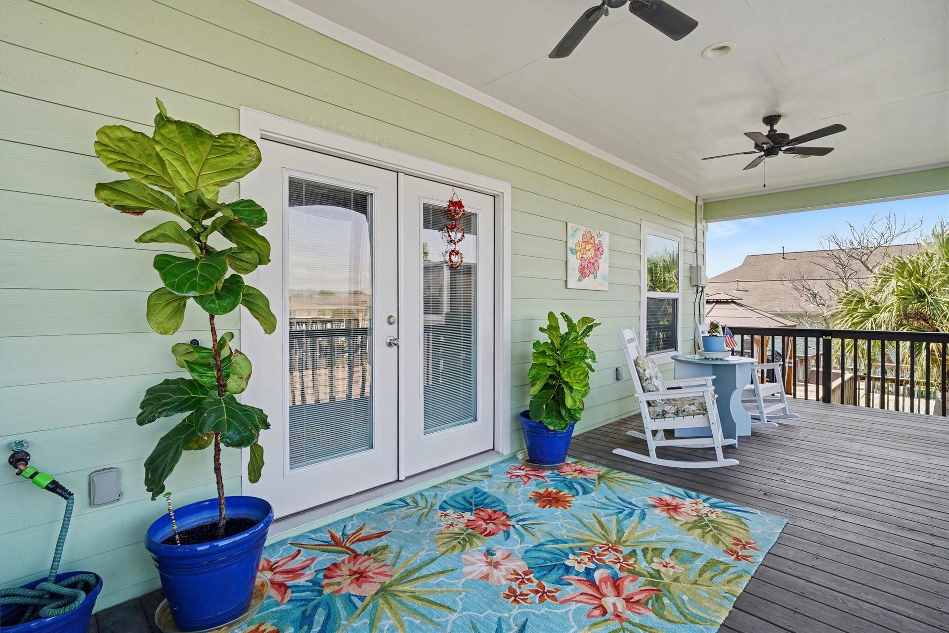 437 Pompano Street, Bayou Vista, TX 77563 Gorgeous oversized covered porch offering the perfect setting for every momentsip your morning coffee as the day begins, enjoy cozy evening dinners under the glow of sunset, or simply unwind in this serene outdoor retreat