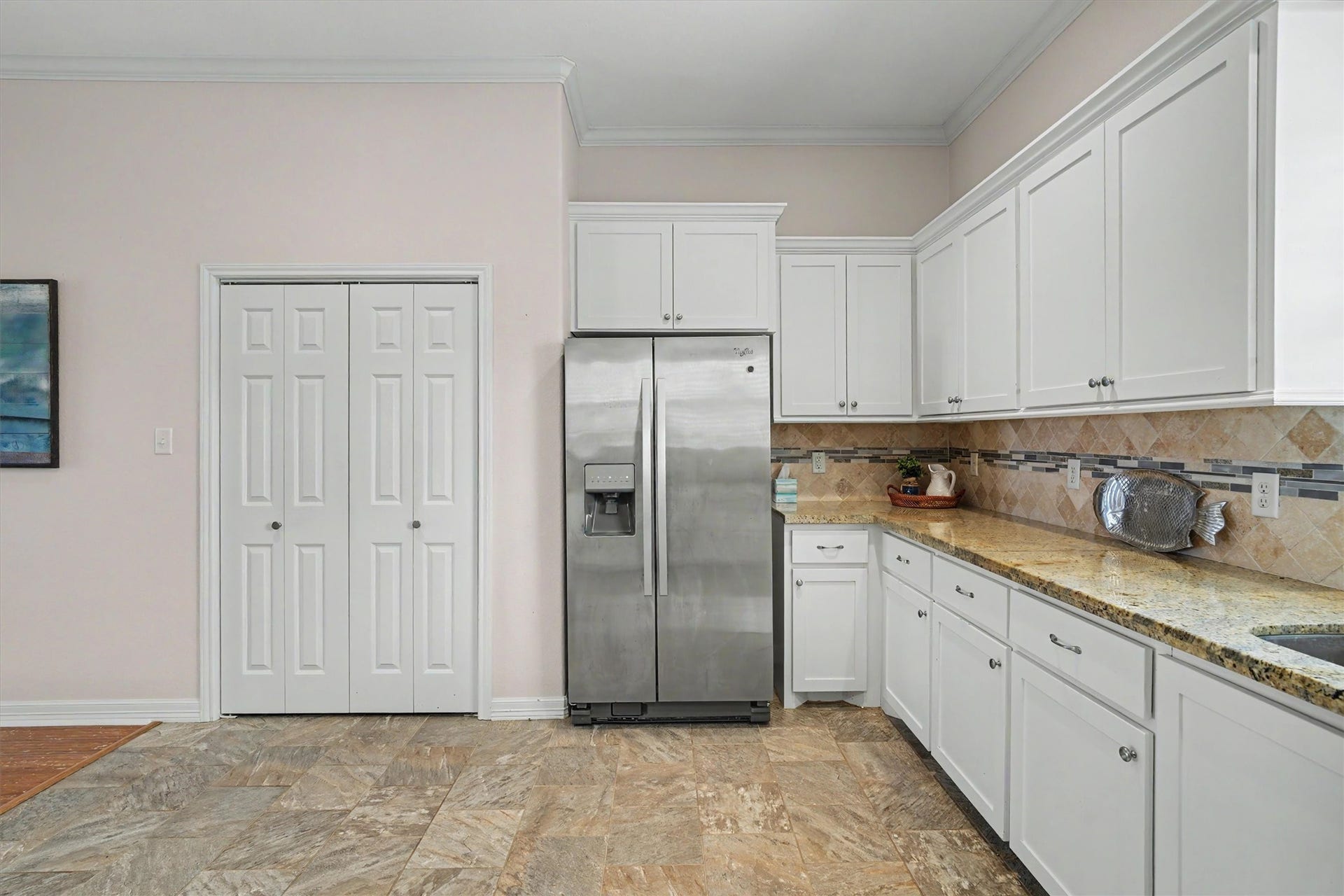 437 Pompano Street, Bayou Vista, TX 77563 The refrigerator, a generous inclusion, stays with the home, ensuring you're ready to store your fresh ingredients from day one. Behind the doors, discover an impressively large pantry, providing ample space for all your kitchen essentials and more. With such thoughtful features, this kitchen truly caters to both the everyday chef and the gourmet enthusiast alike