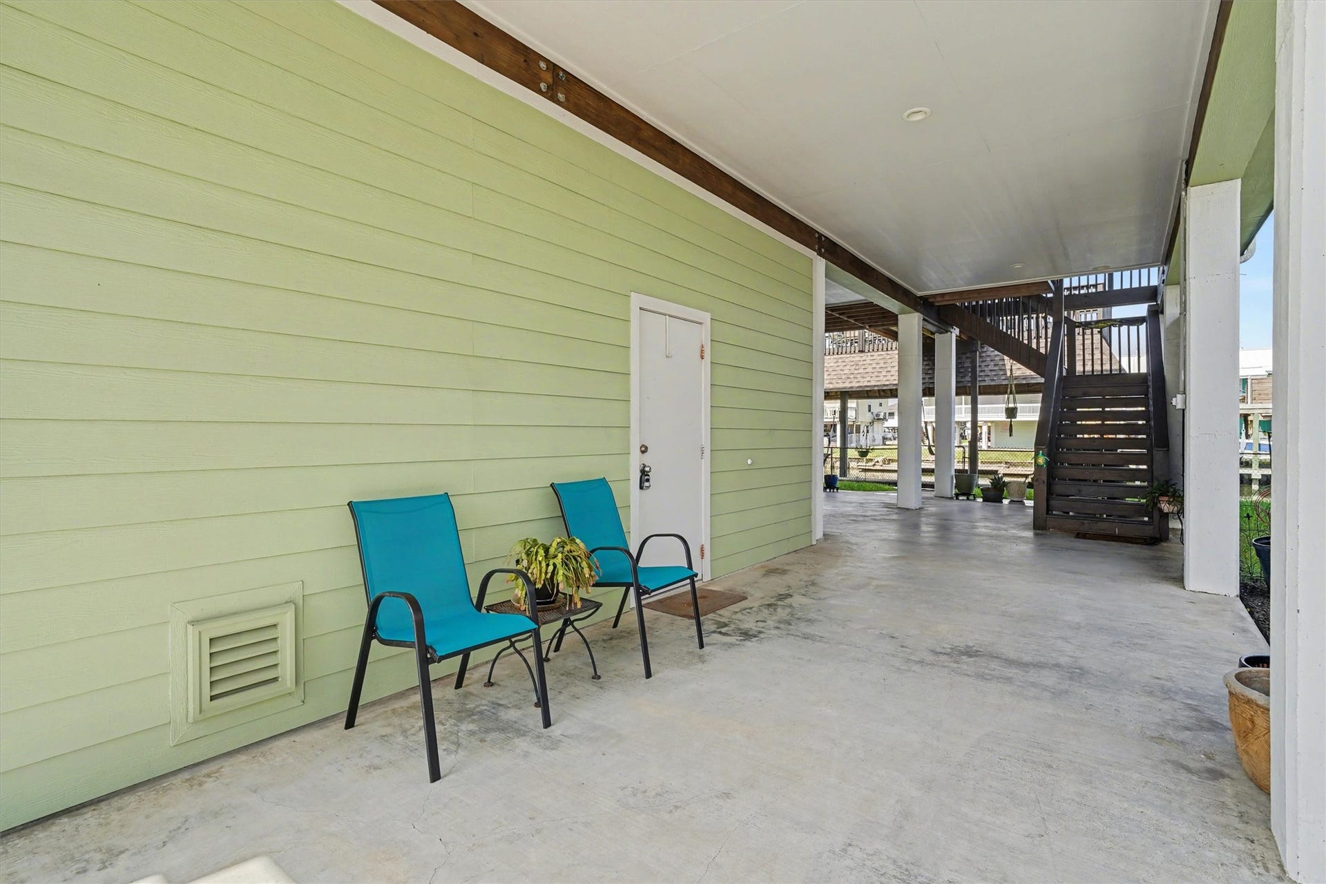 437 Pompano Street, Bayou Vista, TX 77563 Downstairs open bay offering endless versatilitykeep it open for breezy waterfront enjoyment, use it for additional parking, or furnish it for extra outdoor living space. The ideal spot to park a golf cart and embrace the relaxed coastal lifestyle