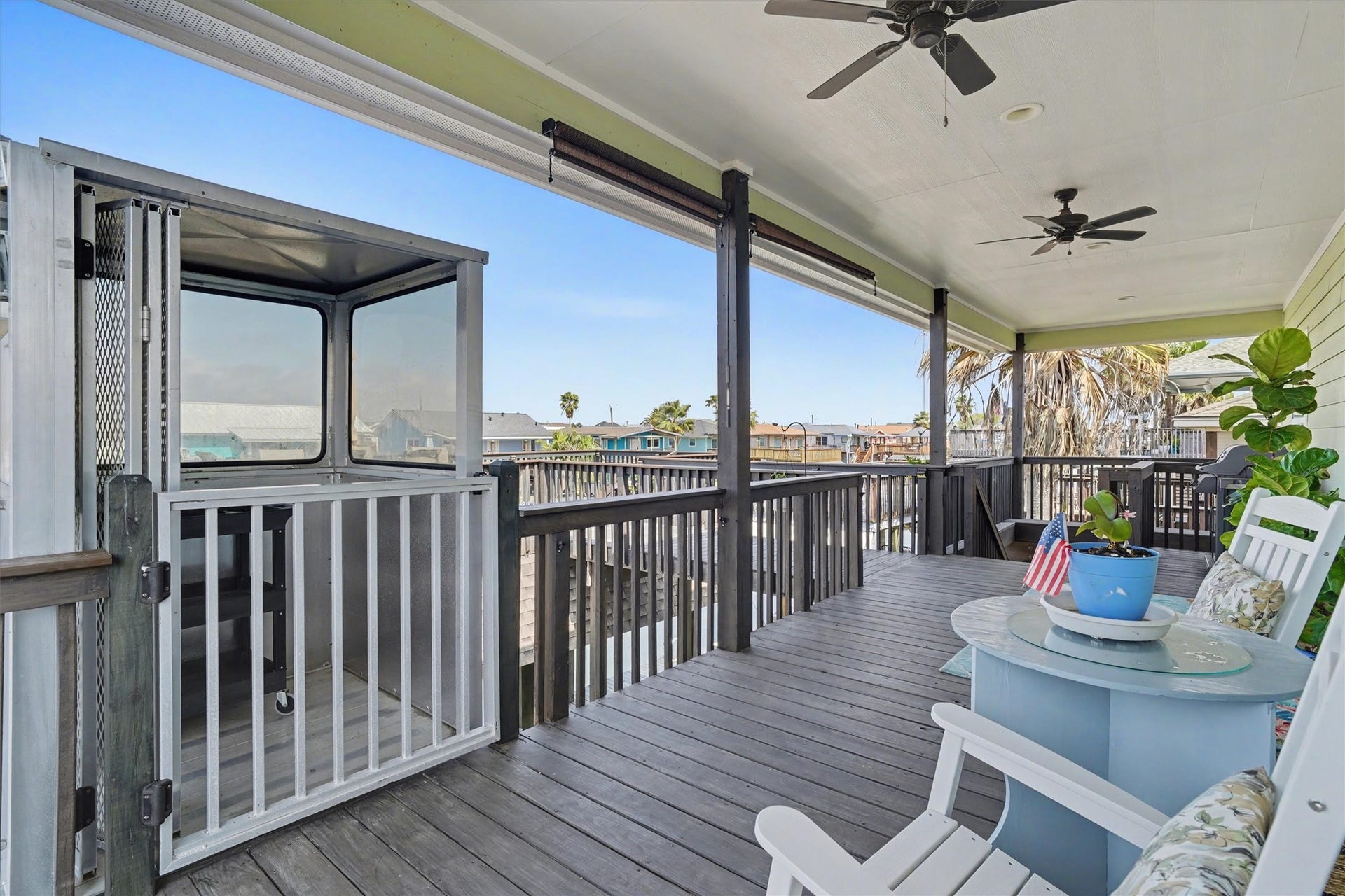 437 Pompano Street, Bayou Vista, TX 77563 Charming covered porch offering a welcoming entry and relaxing outdoor space, complemented by a convenient enclosed cargo liftblending coastal style with everyday functionality for effortless living. The cargo lift is an expensive addition