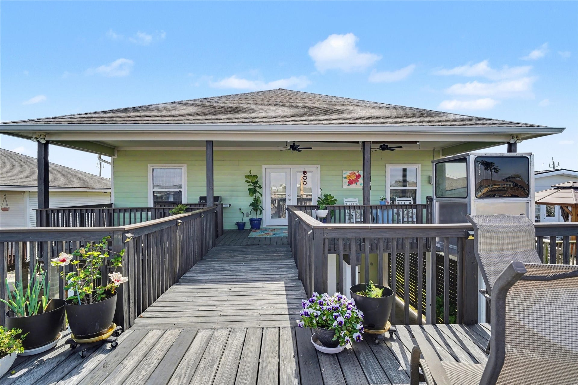 437 Pompano Street, Bayou Vista, TX 77563 Breathtaking view of the home and catwalk from the upper party deck above the boathousean incredible vantage point to take in the architecture and waterfront setting. Built in 2016, this home continues to shine with timeless beauty and enduring charm