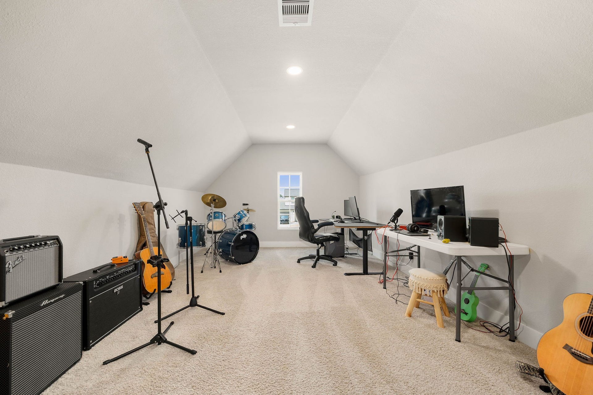 Fantastic climate-controlled finished space (375 sq ft) ideal for a music room, studio, game room, home office or hobby space.