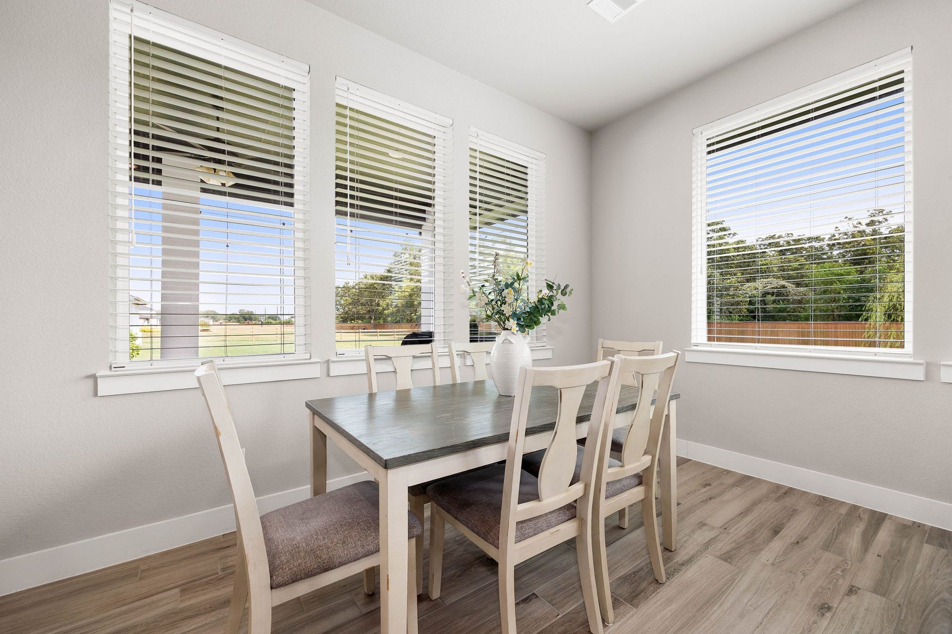 Comfortable dining space flows easily into the kitchen and living areas.