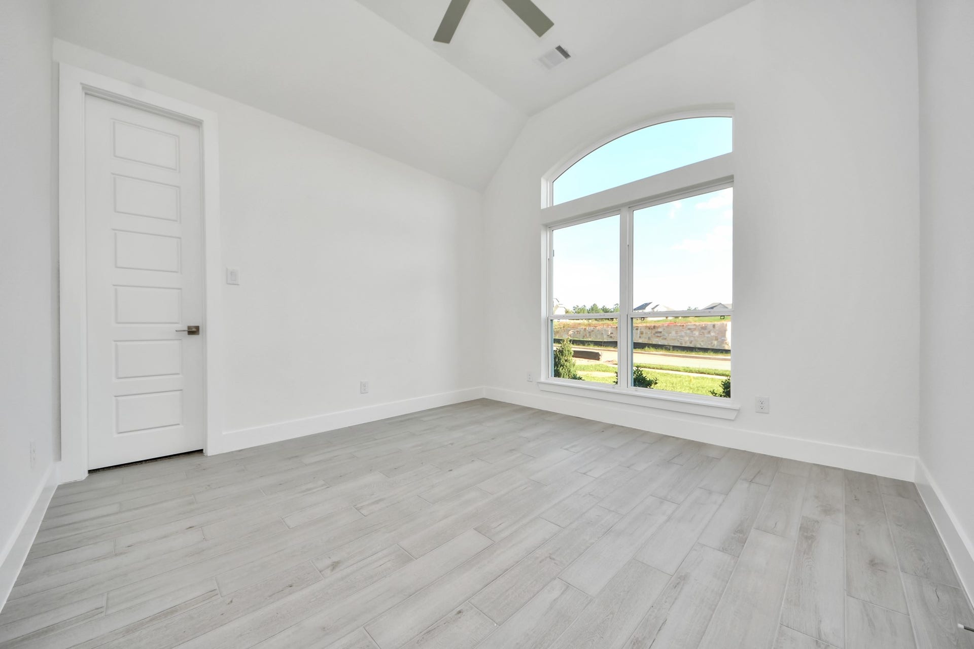 Step into the inviting home office, where elegant tile flooring adds a touch of freshness and comfort to the workspace. Natural light pours through the window, creating an inspiring environment for productivity and focus.