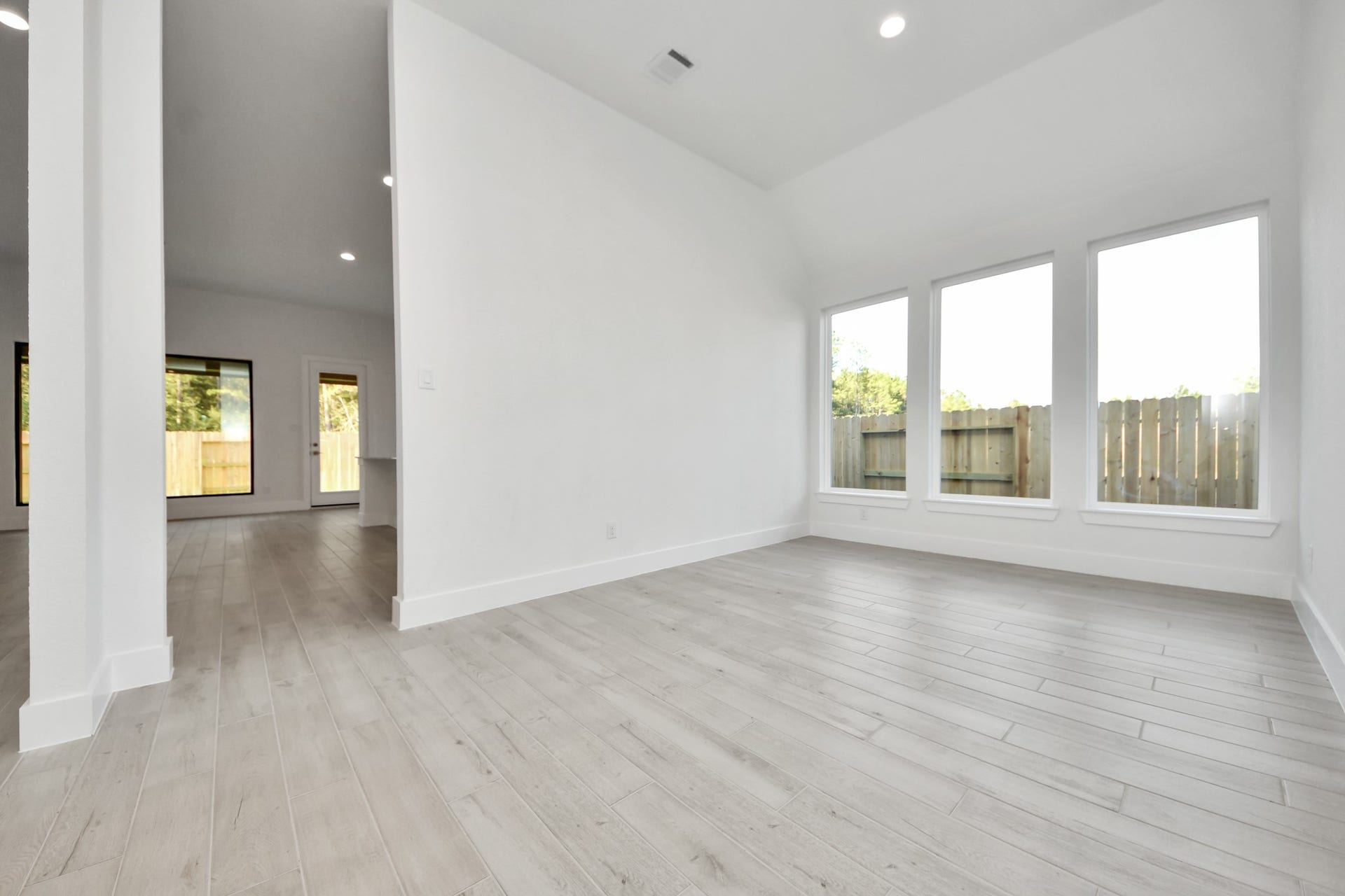 Make memories gathered around the table with your family and friends! This spacious dining room features elegant flooring, custom paint, and adjacent to family room and kitchen for open concept feel.