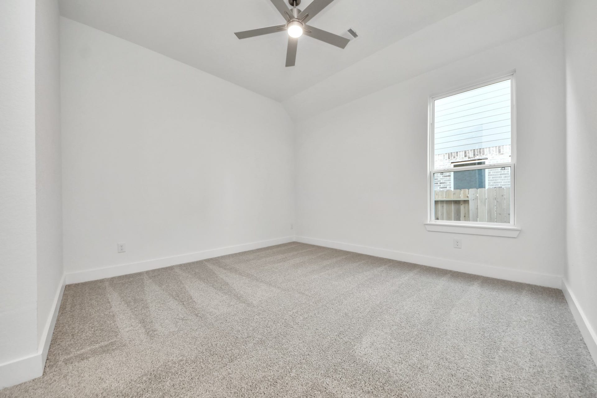 Generously sized secondary bedrooms featuring spacious closets, soft and inviting carpeting underfoot, large windows allowing plenty of natural light, and the added touch of privacy blinds for your personal retreat.