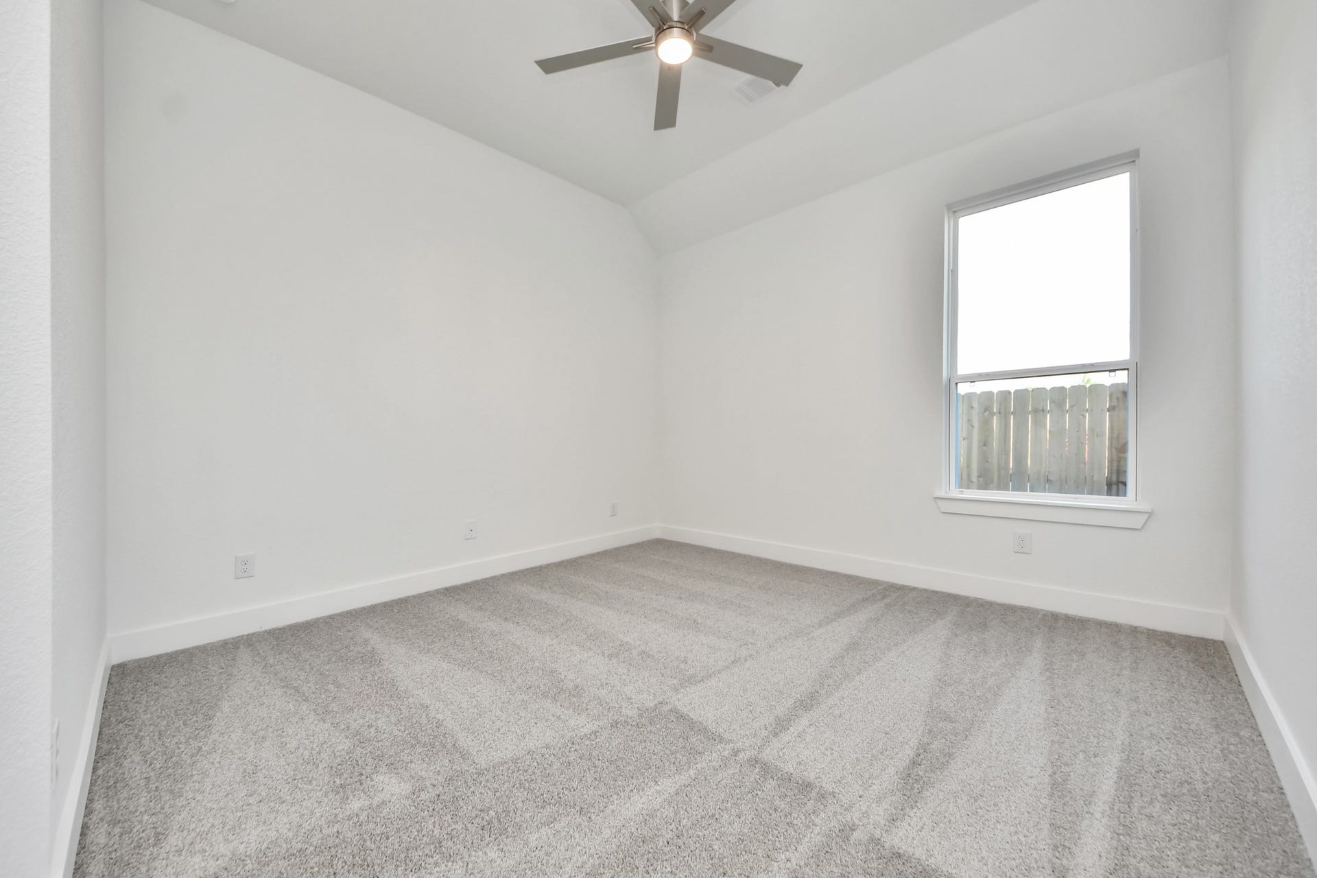 Generously sized secondary bedrooms featuring spacious closets, soft and inviting carpeting underfoot, large windows allowing plenty of natural light, and the added touch of privacy blinds for your personal retreat.