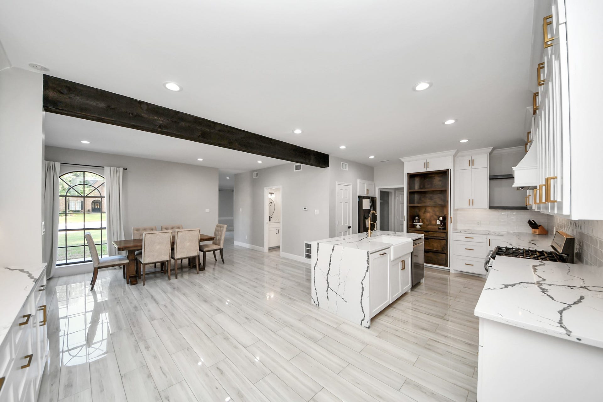 24 Hornsilver Place, The Woodlands, TX 77381 Spacious open-concept kitchen and dining area perfect for entertaining and family gatherings.