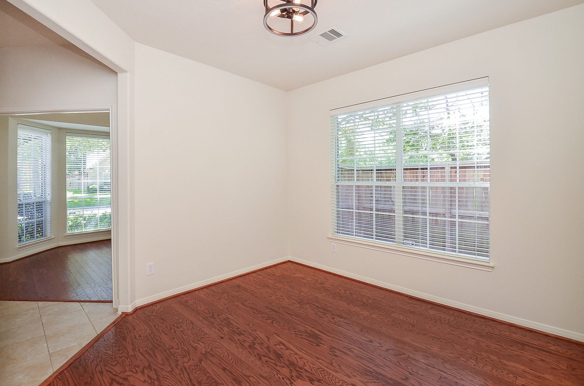 4746 Autumn Orchard Lane, Katy, TX 77494 Bright and inviting, this dining room offers an abundance of natural light through large windows, creating the perfect setting for memorable gatherings.