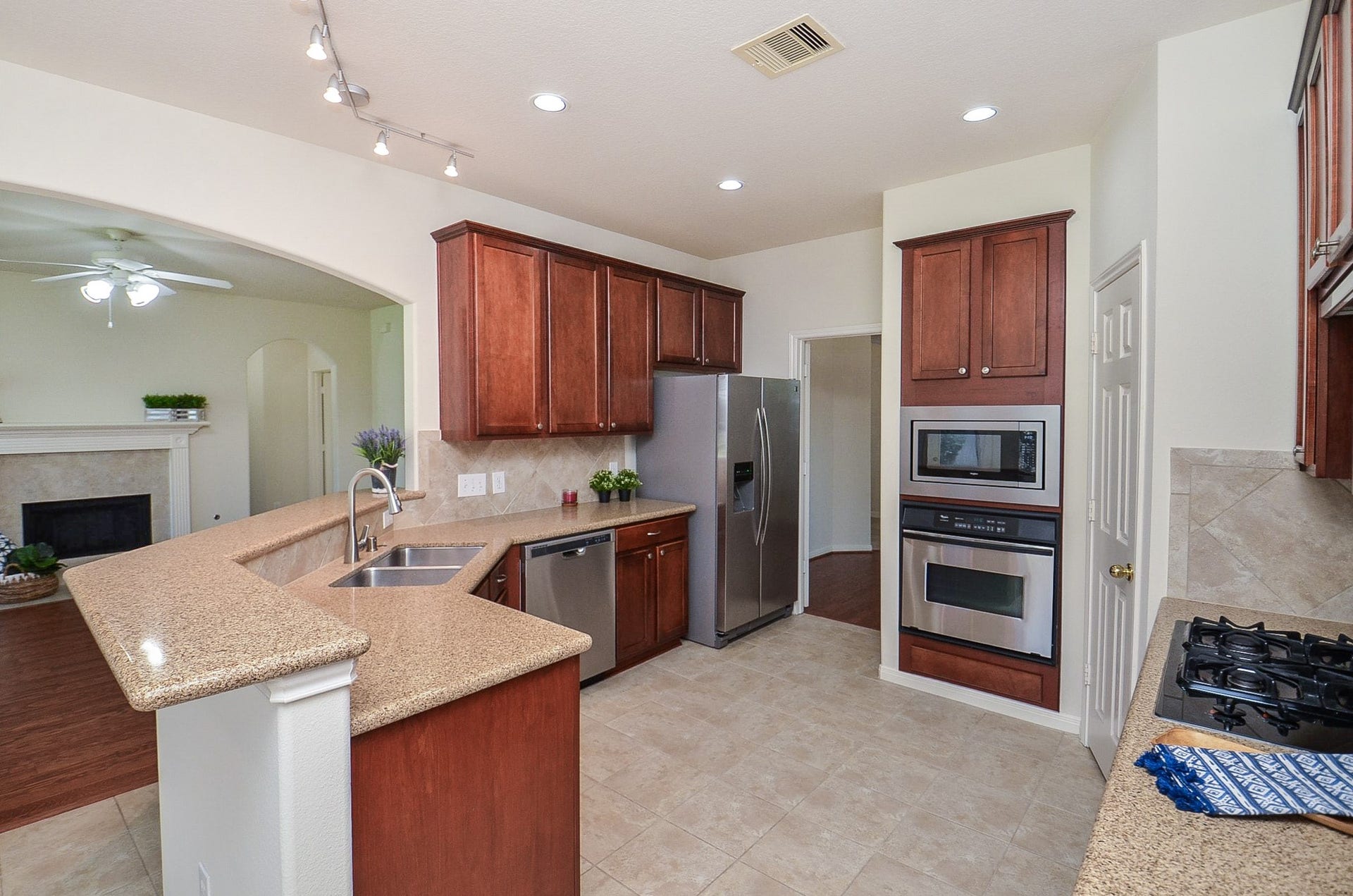 4746 Autumn Orchard Lane, Katy, TX 77494 The kitchen features abundant natural light from large windows, and perfect for culinary creativity.