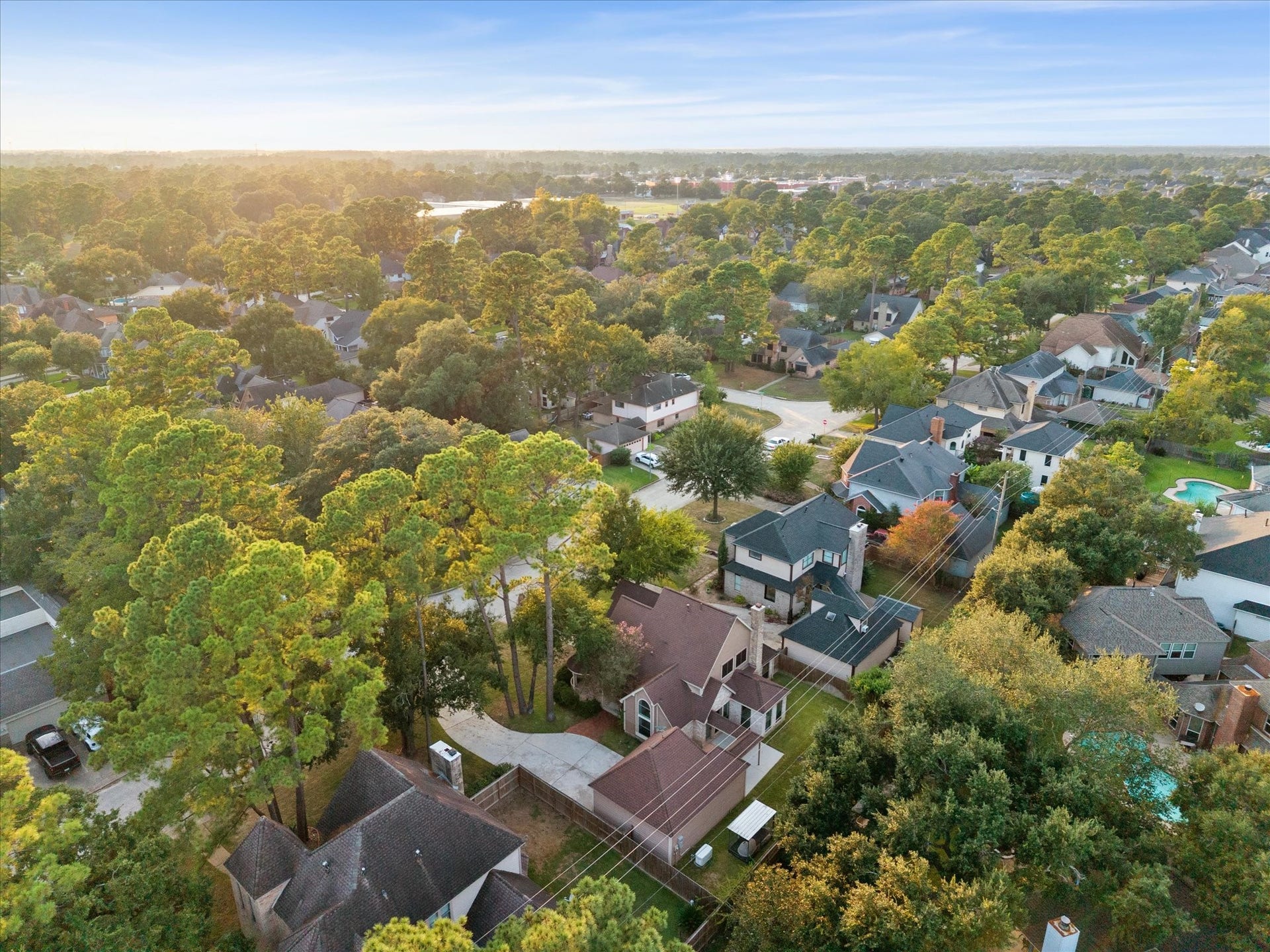 18006 Memorial Estates Drive, Spring, TX 77379 A wide aerial of the neighborhood and its tree cover in Spring.