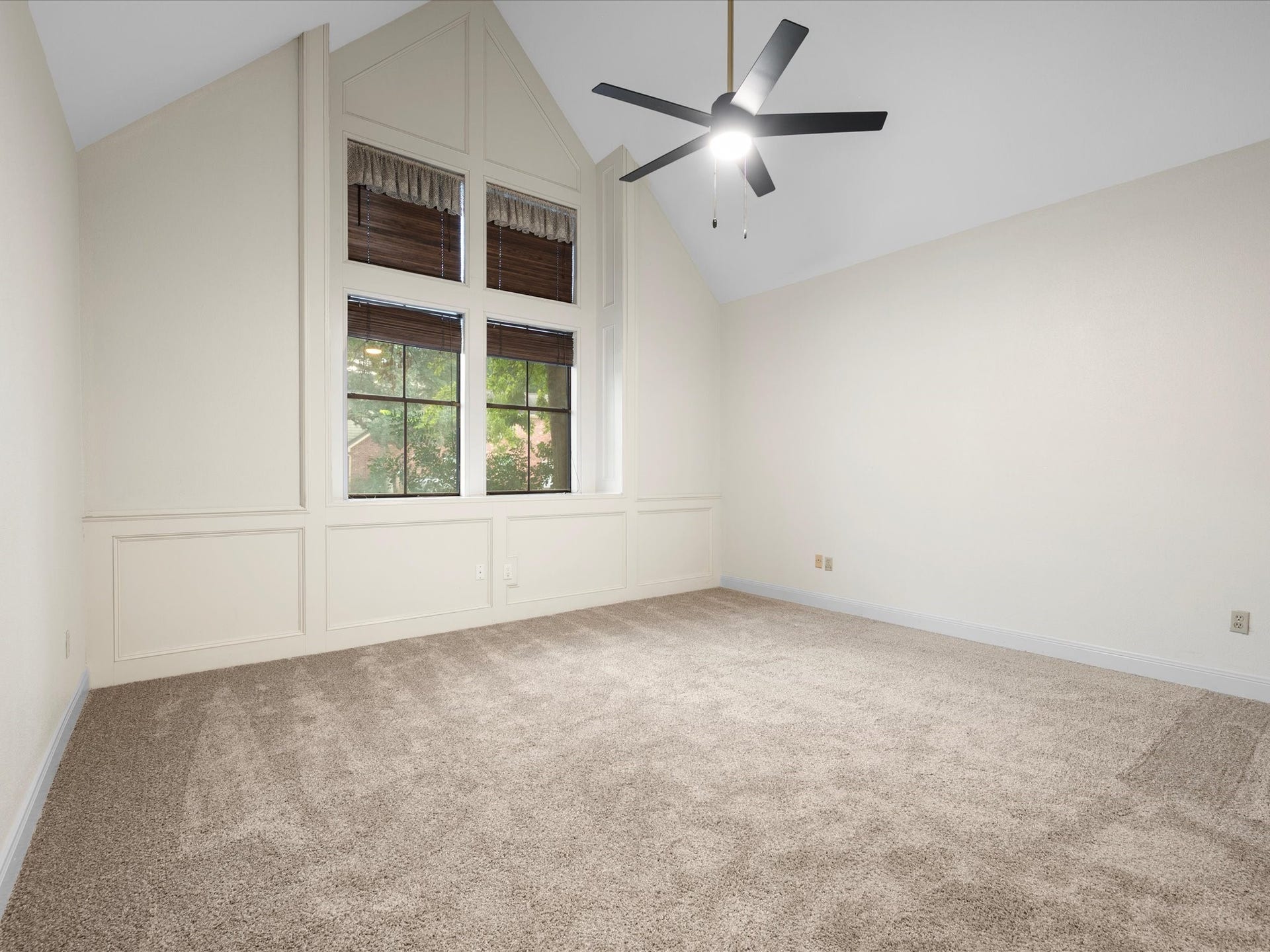 18006 Memorial Estates Drive, Spring, TX 77379 The primary bedroom is on the first floor, with a vaulted ceiling, fresh carpet, and a ceiling fan.