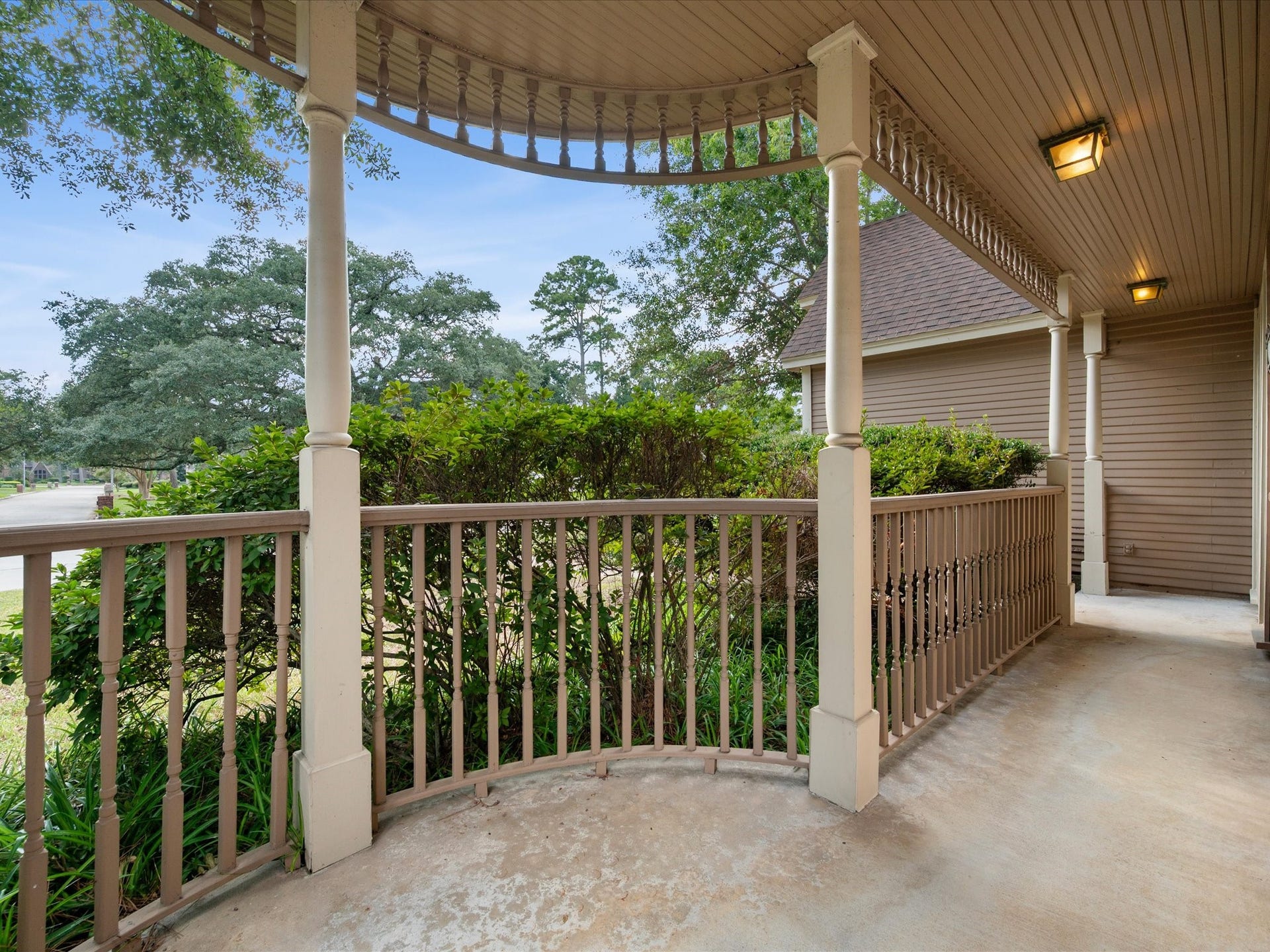 18006 Memorial Estates Drive, Spring, TX 77379 The covered front porch wraps around the corner of the house. There's room for a couple of rockers and a slow morning.