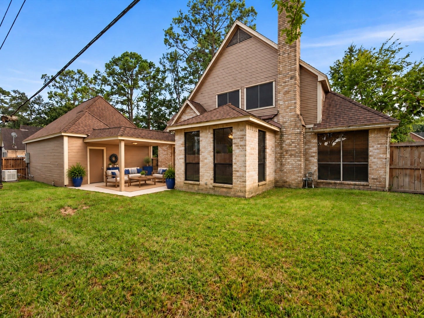 18006 Memorial Estates Drive, Spring, TX 77379 The backyard has plenty of grass, with the detached garage at the back.