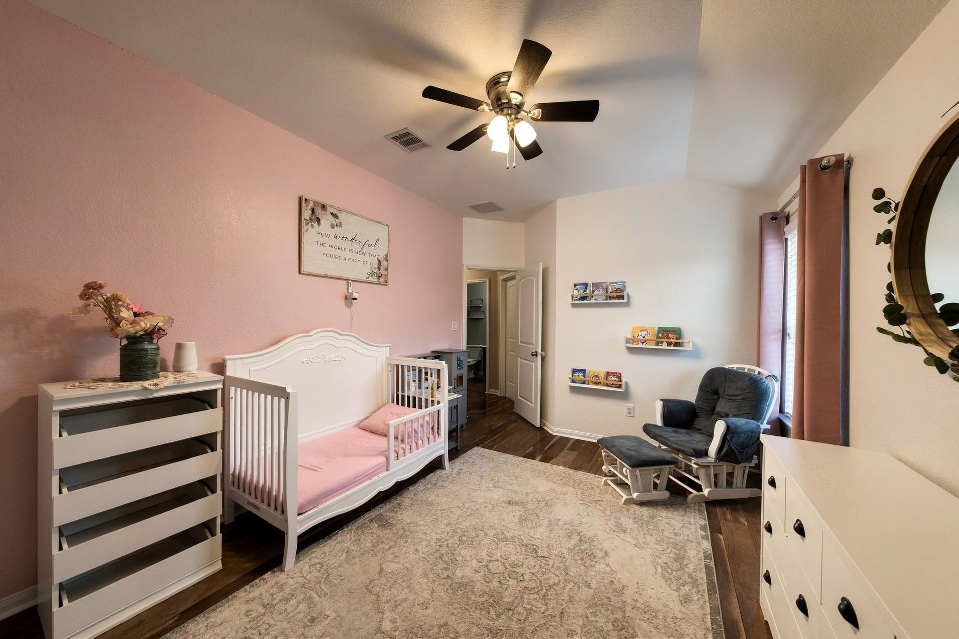 336 Country Crossing Circle, Magnolia, TX 77354 Charming nursery with a soft pink accent wall.