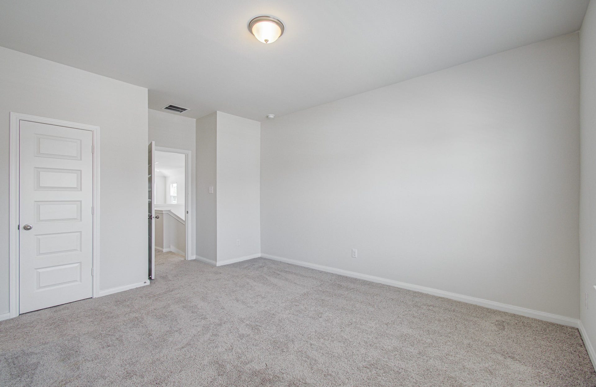 14210 Aston Pine Drive, Houston, TX 77032 Spacious, bright room with plush carpeting and neutral walls, offering a versatile blank canvas for your personal touch. Please Note this is a different home/floorplan in the community.