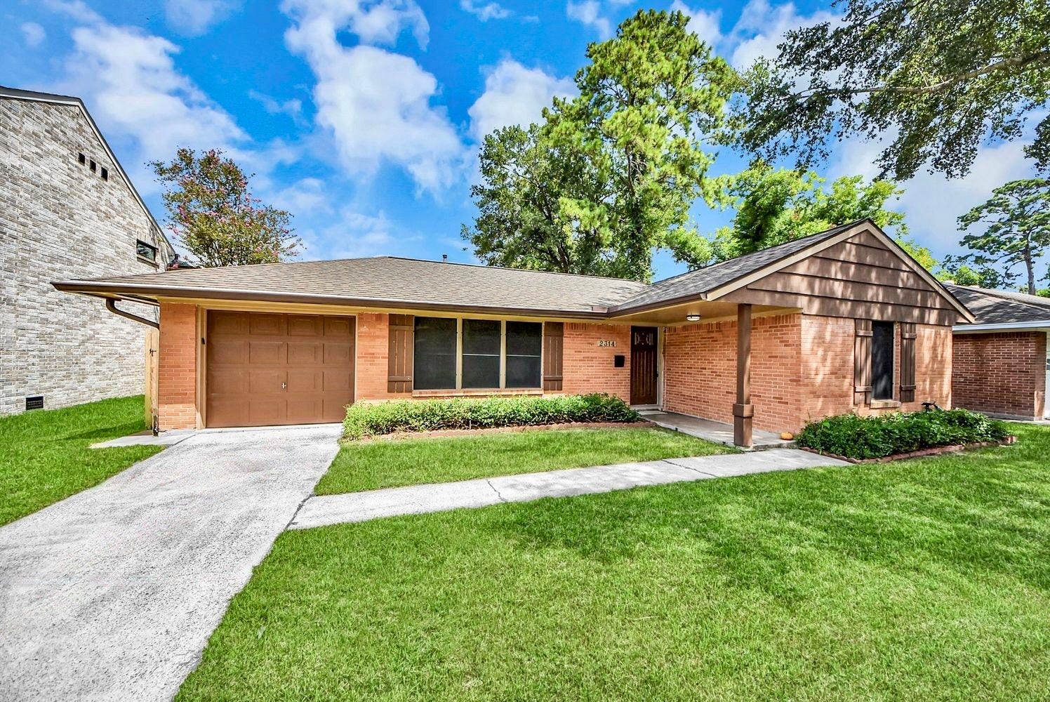 2314 Lamonte Lane, Houston, TX 77018 Home facade with driveway into attached garage.