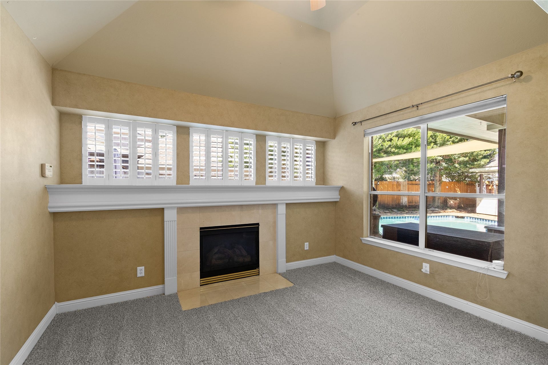 11 Saint Thomas Court, Houston, TX 77070 YOUR OWN PRIVATE SANCTUARY! The primary suite's approximately 13 10 sitting area features a fireplace and beautiful backyard views, creating a lovely retreat for reading, relaxing or enjoying a quiet evening.