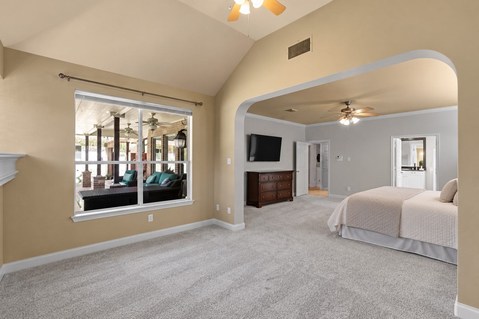 11 Saint Thomas Court, Houston, TX 77070 Luxury meets comfort in this exceptional first-floor primary retreat, where an expansive bedroom connects to a separate fireside sitting area filled with natural light. **Virtually Staged**