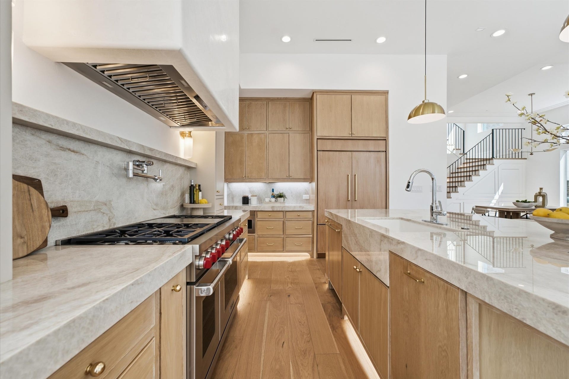 4313 Lula Street, Bellaire, TX 77401 Beautiful kitchen featuring generous cabinetry, modern appliances, and sleek countertops.