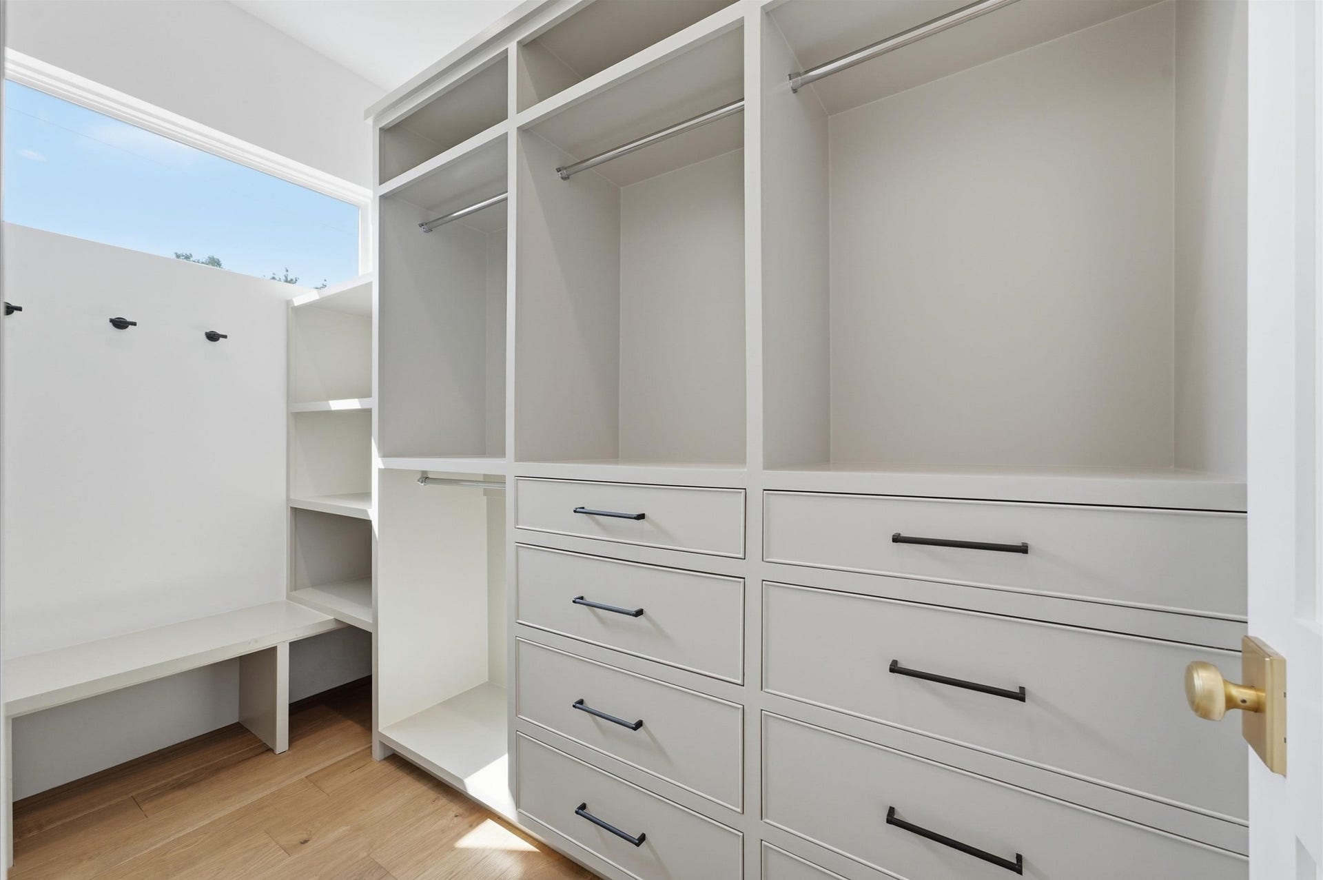 4313 Lula Street, Bellaire, TX 77401 Custom walk-in closet with built-in drawers, shelving, and generous storage space.