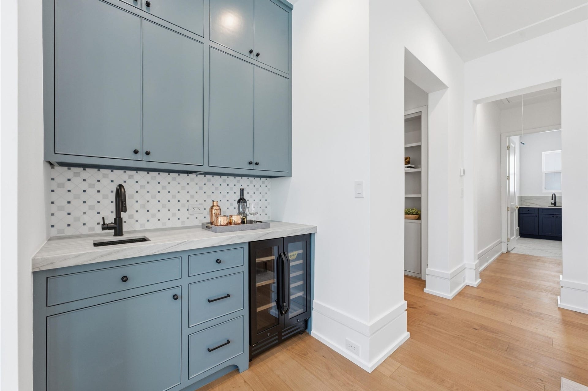 4313 Lula Street, Bellaire, TX 77401 Stylish secondary kitchen or bar area with blue cabinetry and modern finishes.