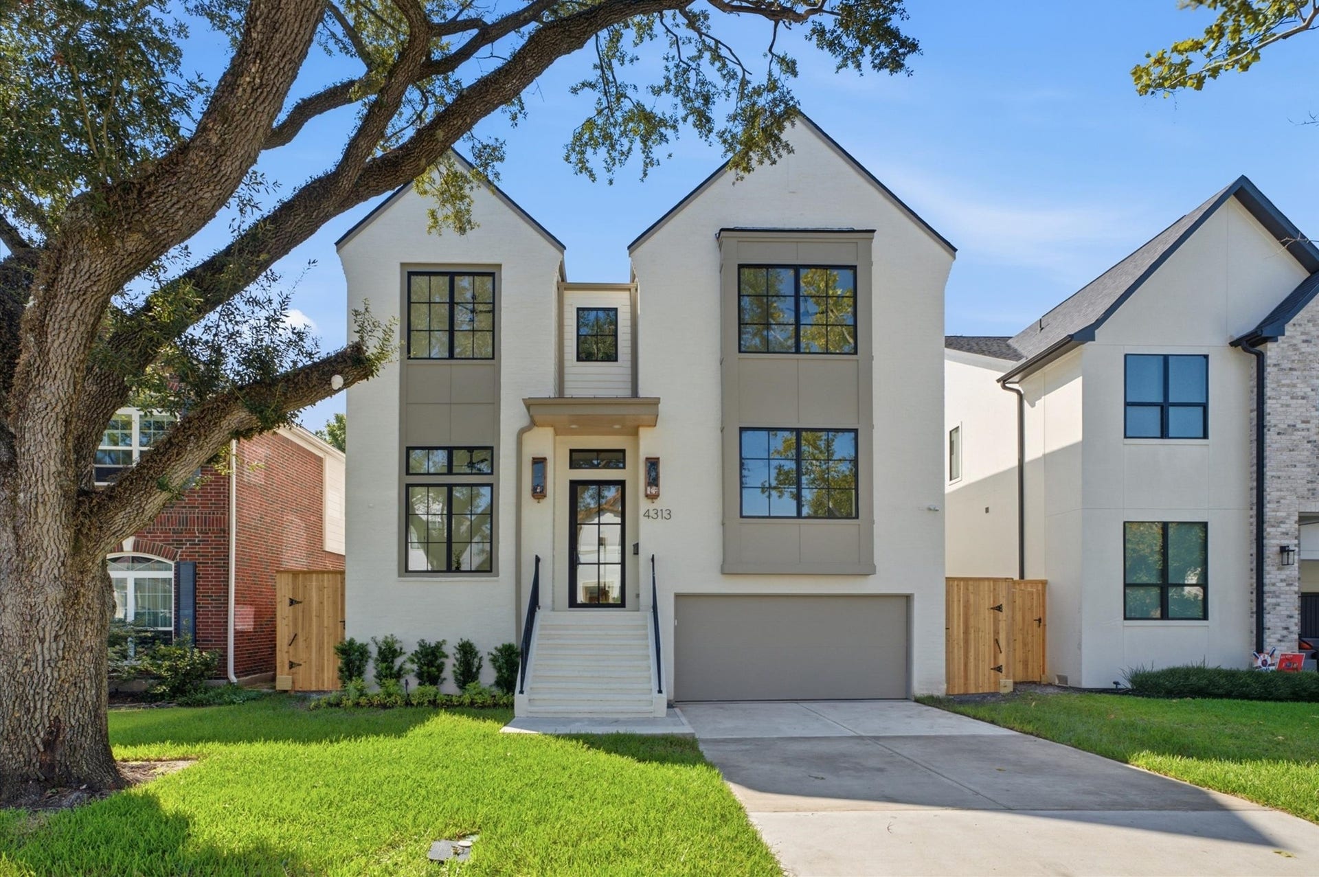 4313 Lula Street, Bellaire, TX 77401 Beautiful front exterior with manicured lawn, modern design, and inviting entry.
