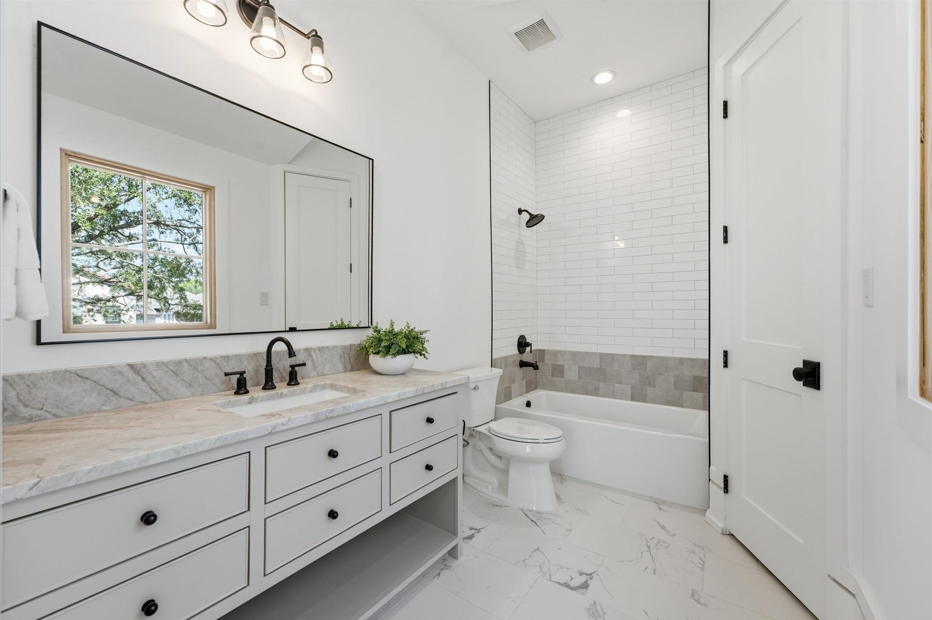 4313 Lula Street, Bellaire, TX 77401 Beautiful bathroom with double vanity, modern fixtures, and a bright, airy design.