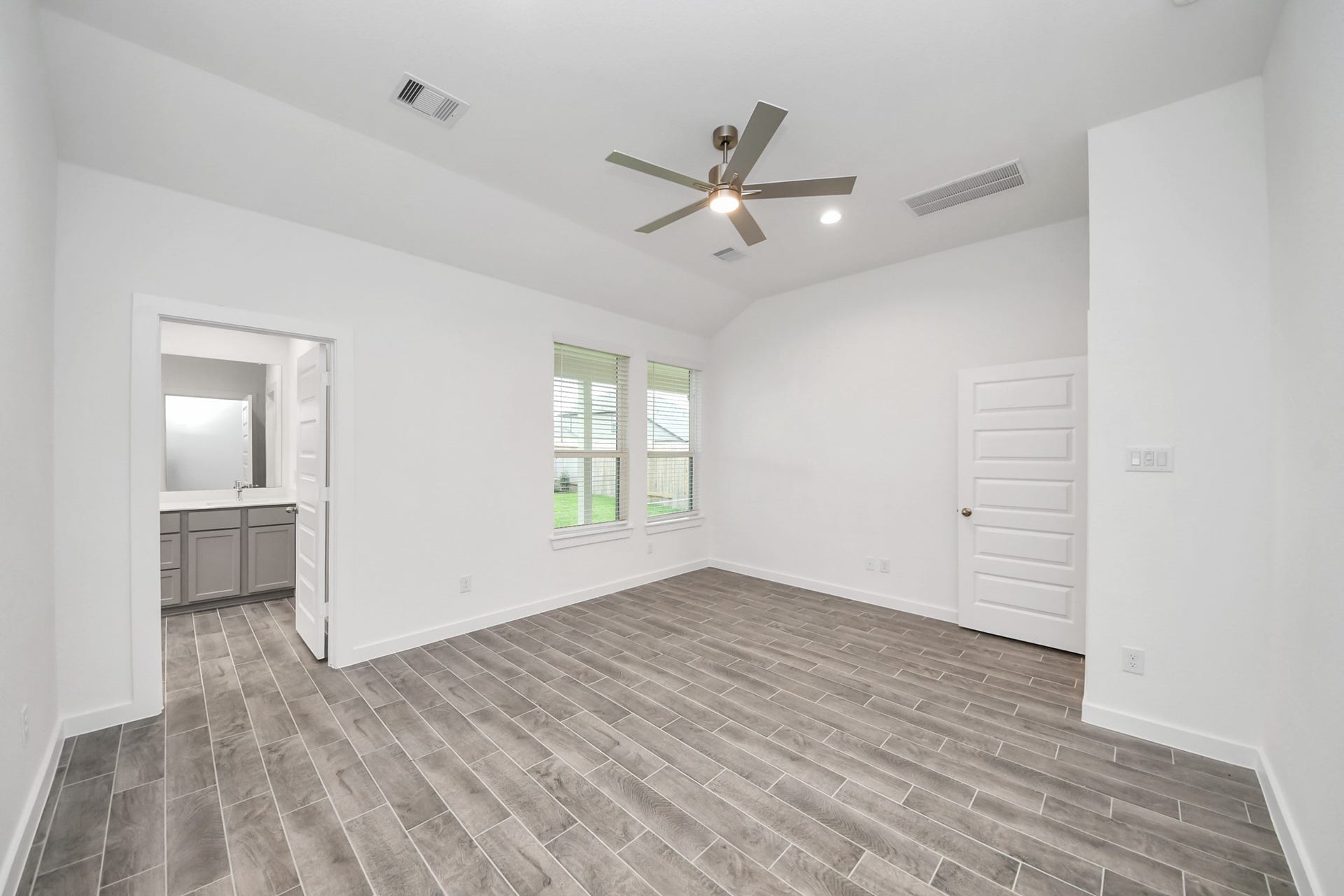 24514 Broad Park Ct, Spring, TX 77373 Retreat to the luxurious primary suite, your perfect escape for unwinding after a long day. Located on the first floor.