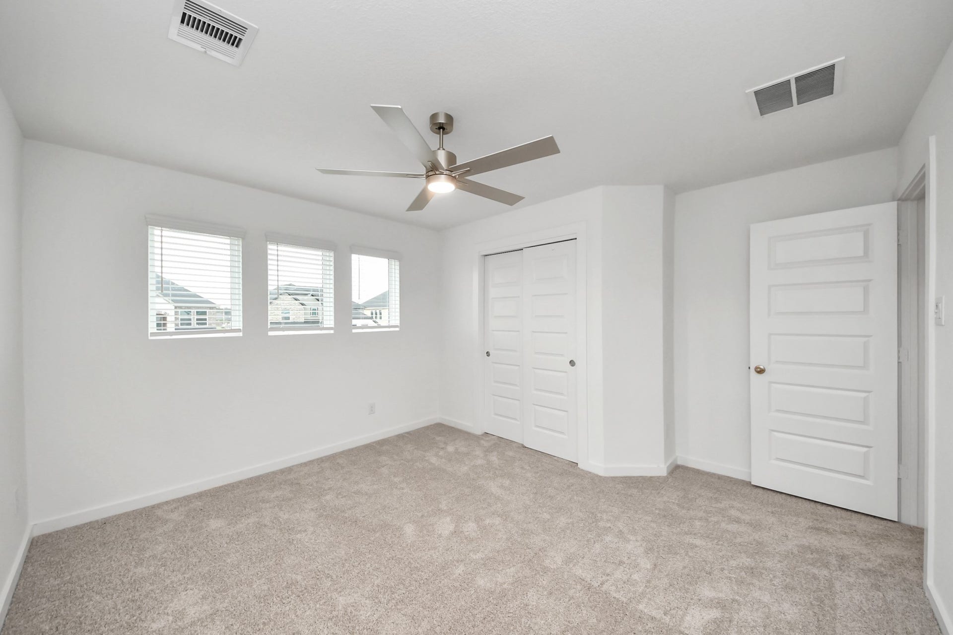 24514 Broad Park Ct, Spring, TX 77373 Generously sized secondary bedrooms featuring spacious closets, soft and inviting carpeting underfoot, large windows allowing plenty of natural light, and the added touch of privacy blinds for your personal retreat.