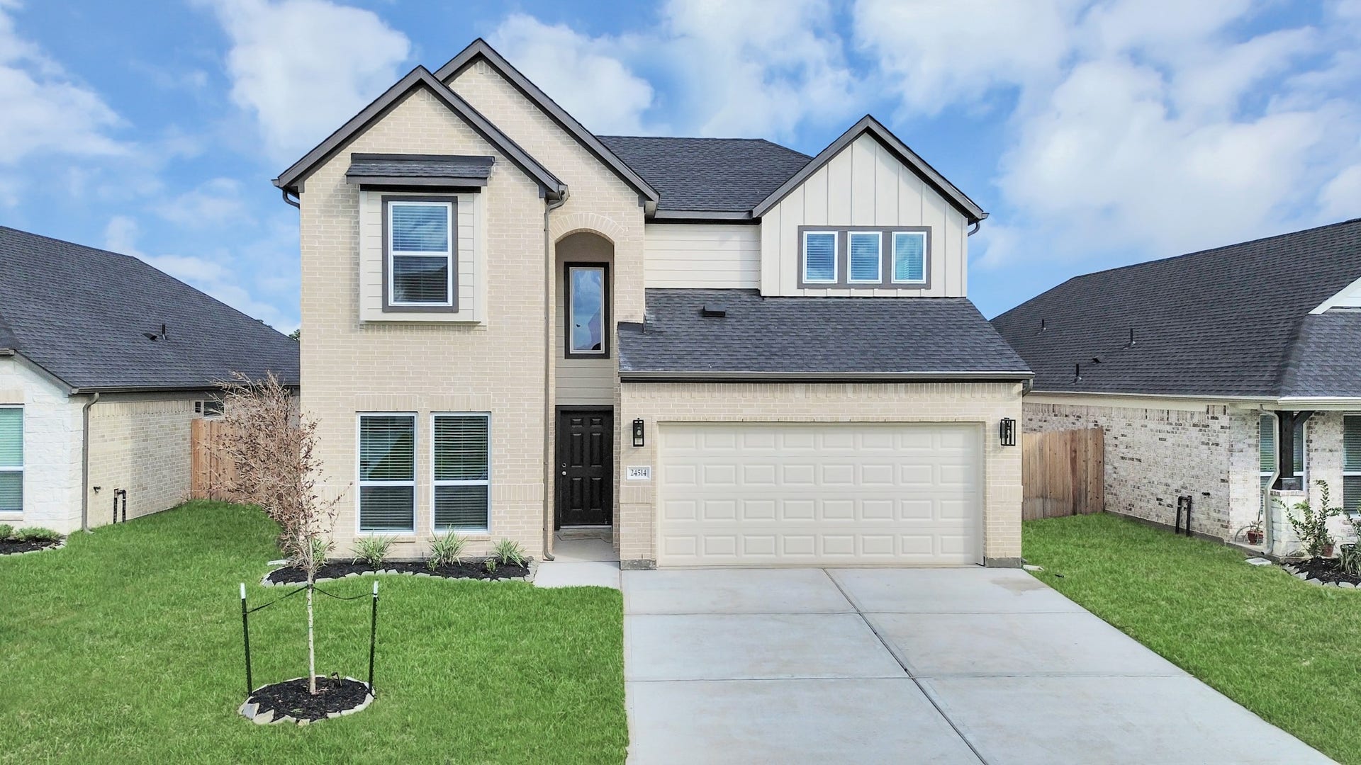 24514 Broad Park Ct, Spring, TX 77373 The residence features a practical 2-car garage complemented by a generous driveway, ensuring abundant space for parking needs.