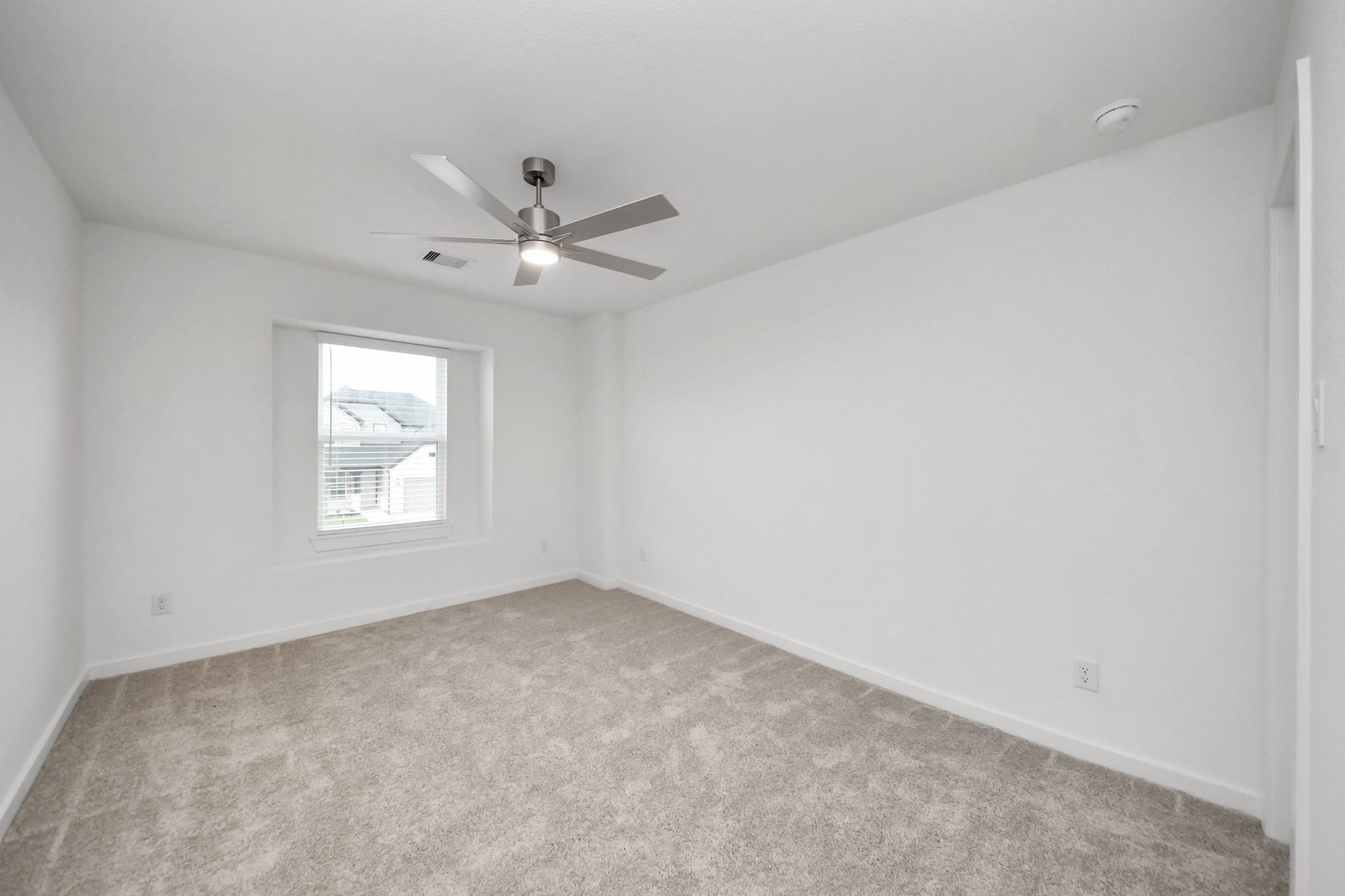 24514 Broad Park Ct, Spring, TX 77373 Secondary bedroom features plush carpeting, large windows that let in plenty of natural light, bright paint, and spacious closets.