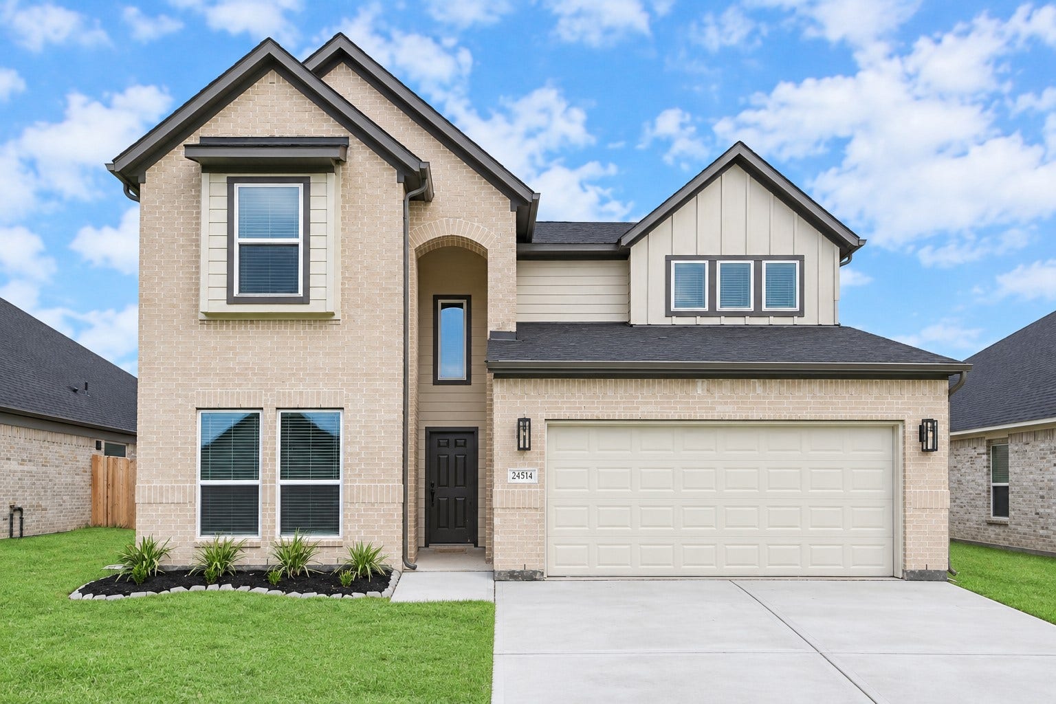 24514 Broad Park Ct, Spring, TX 77373 Meticulously maintained yard and lush landscape, paired with a premium elevation featuring captivating brick accents. Modern coach lights add a touch of contemporary elegance to the exterior.