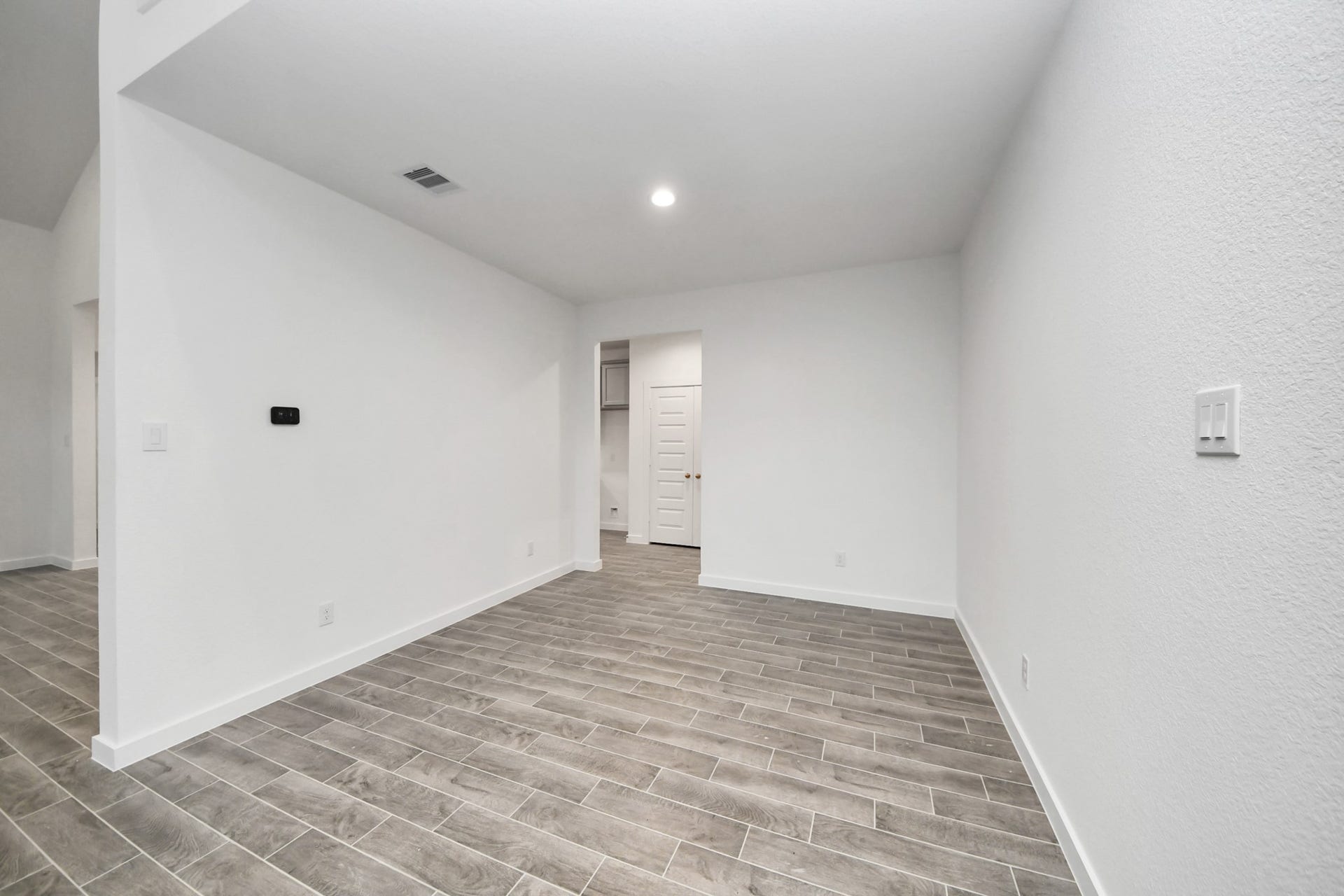 24514 Broad Park Ct, Spring, TX 77373 Make memories gathered around the table with your family and friends! This spacious dining room features elegant flooring, custom paint, and adjacent to family room and kitchen for open concept feel.