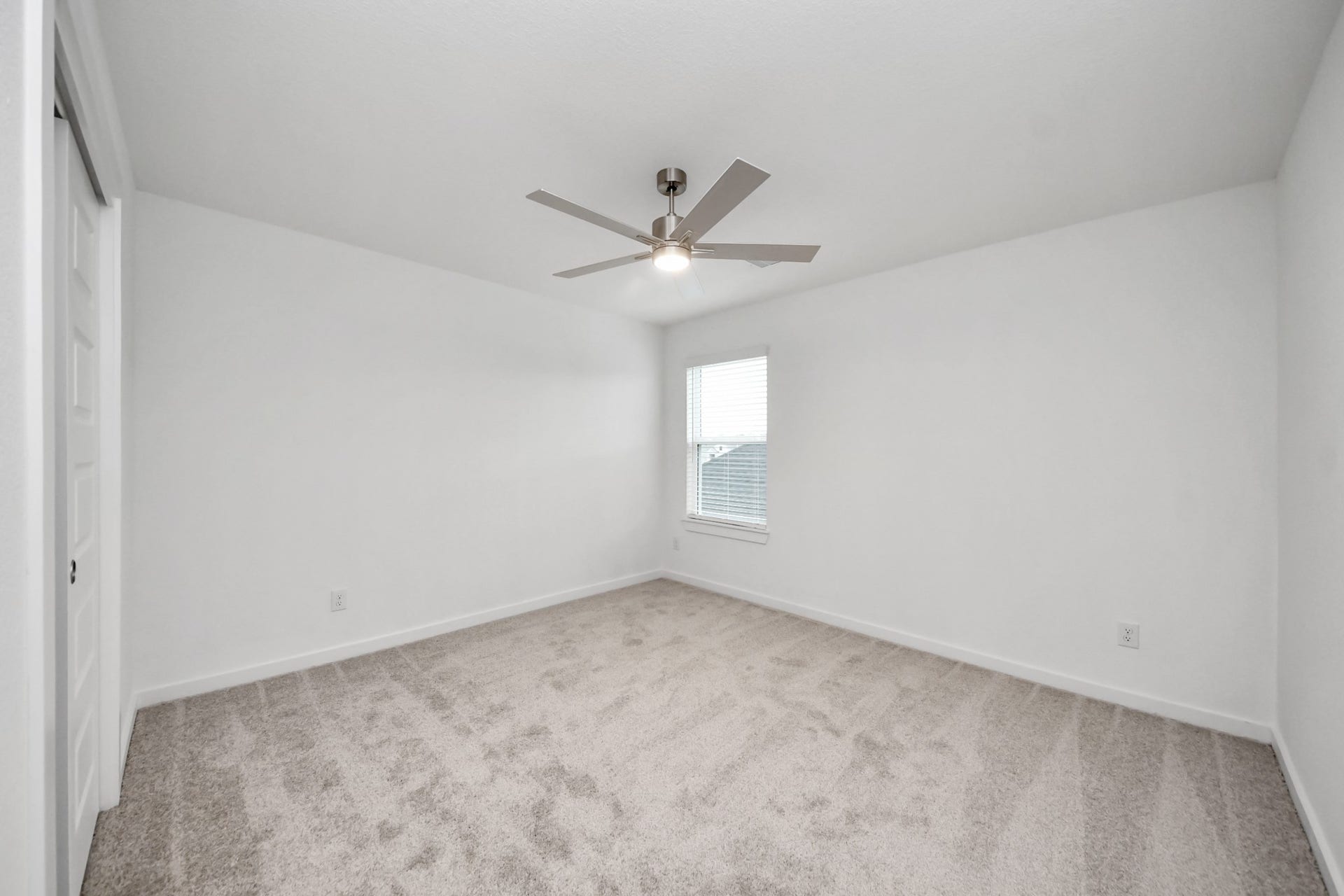 24514 Broad Park Ct, Spring, TX 77373 Generously sized secondary bedrooms featuring spacious closets, soft and inviting carpeting underfoot, large windows allowing plenty of natural light, and the added touch of privacy blinds for your personal retreat.