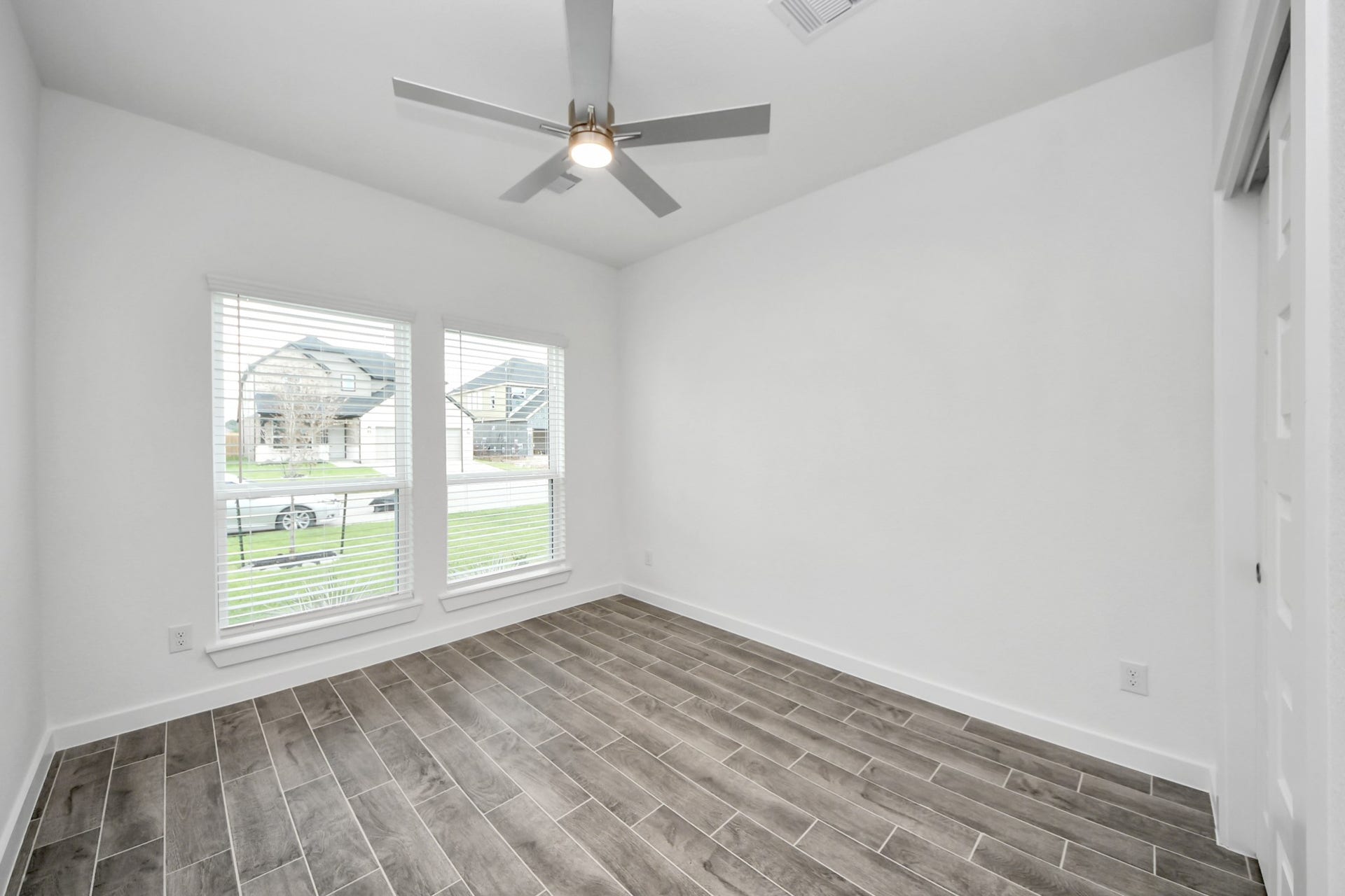 24514 Broad Park Ct, Spring, TX 77373 Generously sized secondary bedrooms featuring spacious closets, soft and inviting carpeting underfoot, large windows allowing plenty of natural light, and the added touch of privacy blinds for your personal retreat.