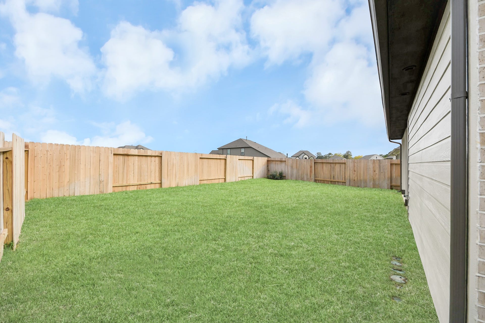 24514 Broad Park Ct, Spring, TX 77373 Come and see this spacious backyard with its beautiful covered patio. There is plenty of room for the kids to play and adults to relax. Perfect for your outdoor living space, patio furniture, bbq pit, and so much more. The possibilities are endless!
Experience outdoor living at its finest on this expansive covered patio, thoughtfully designed for BBQs and delightful outdoor dining.