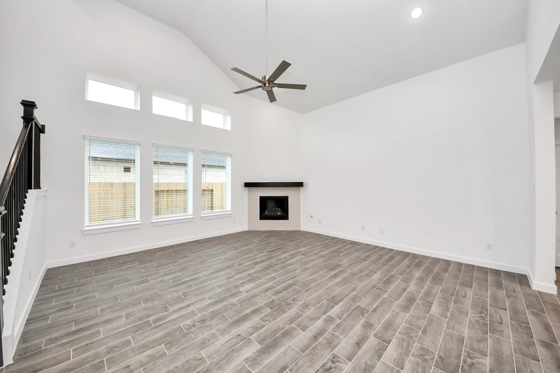 24514 Broad Park Ct, Spring, TX 77373 Welcome family and guests to your charming living room! With its high ceilings, recessed lighting, ceiling fan, custom paint, beautiful flooring, and large windows that let in abundant natural light, this room is perfect for gatherings.