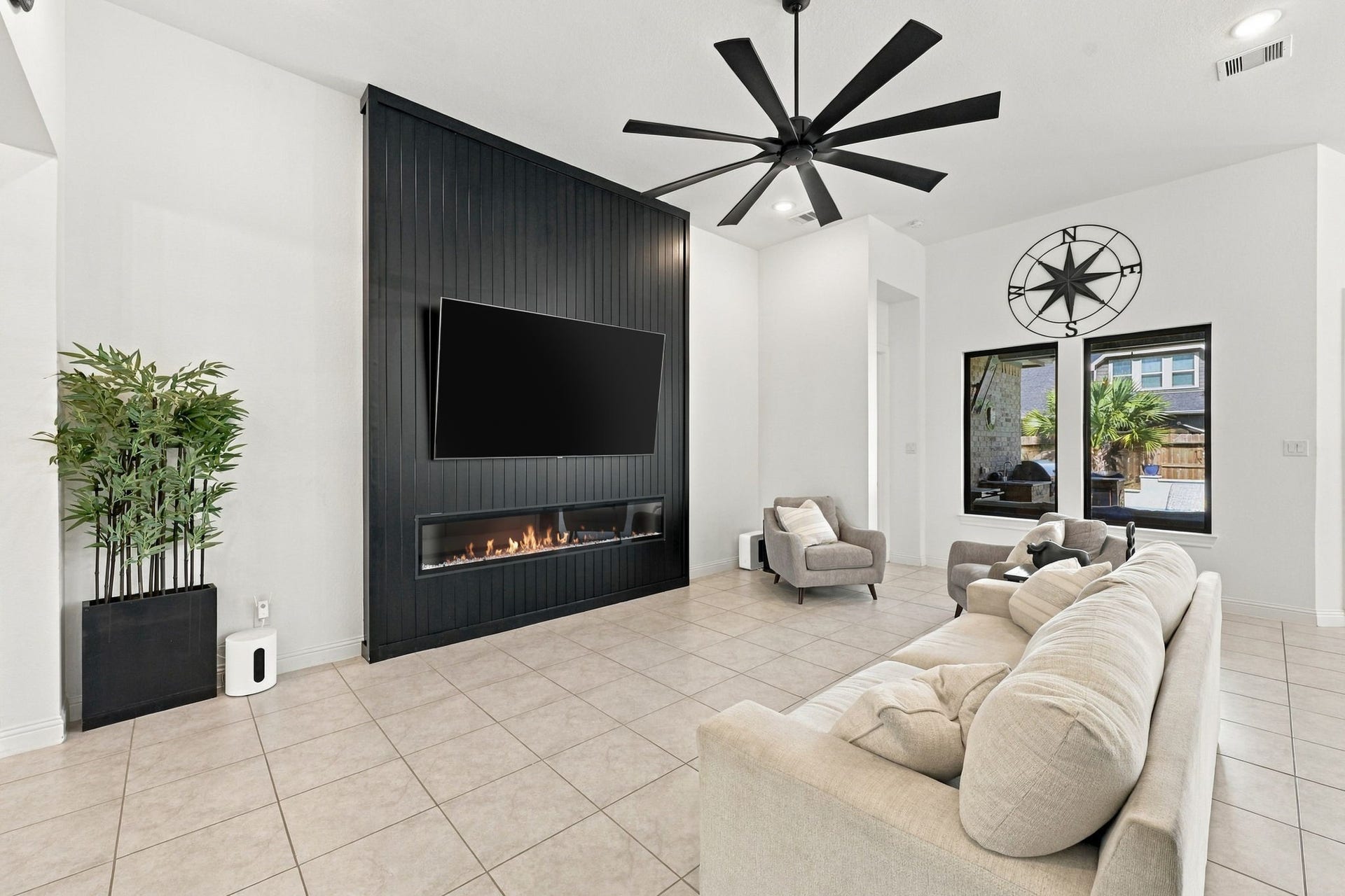 This inviting living space offers abundant natural light and a beautiful setting for everyday living or entertaining.