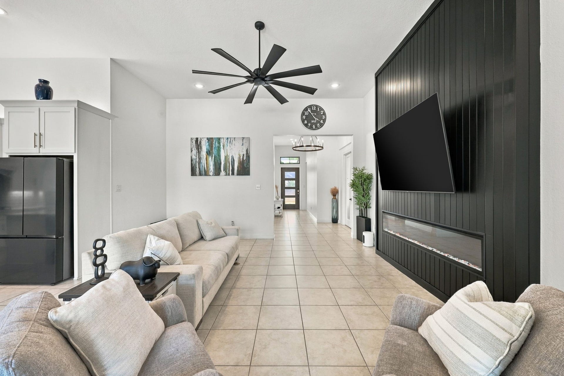 The open-concept design creates a seamless connection between the living room, kitchen, and dining areas.