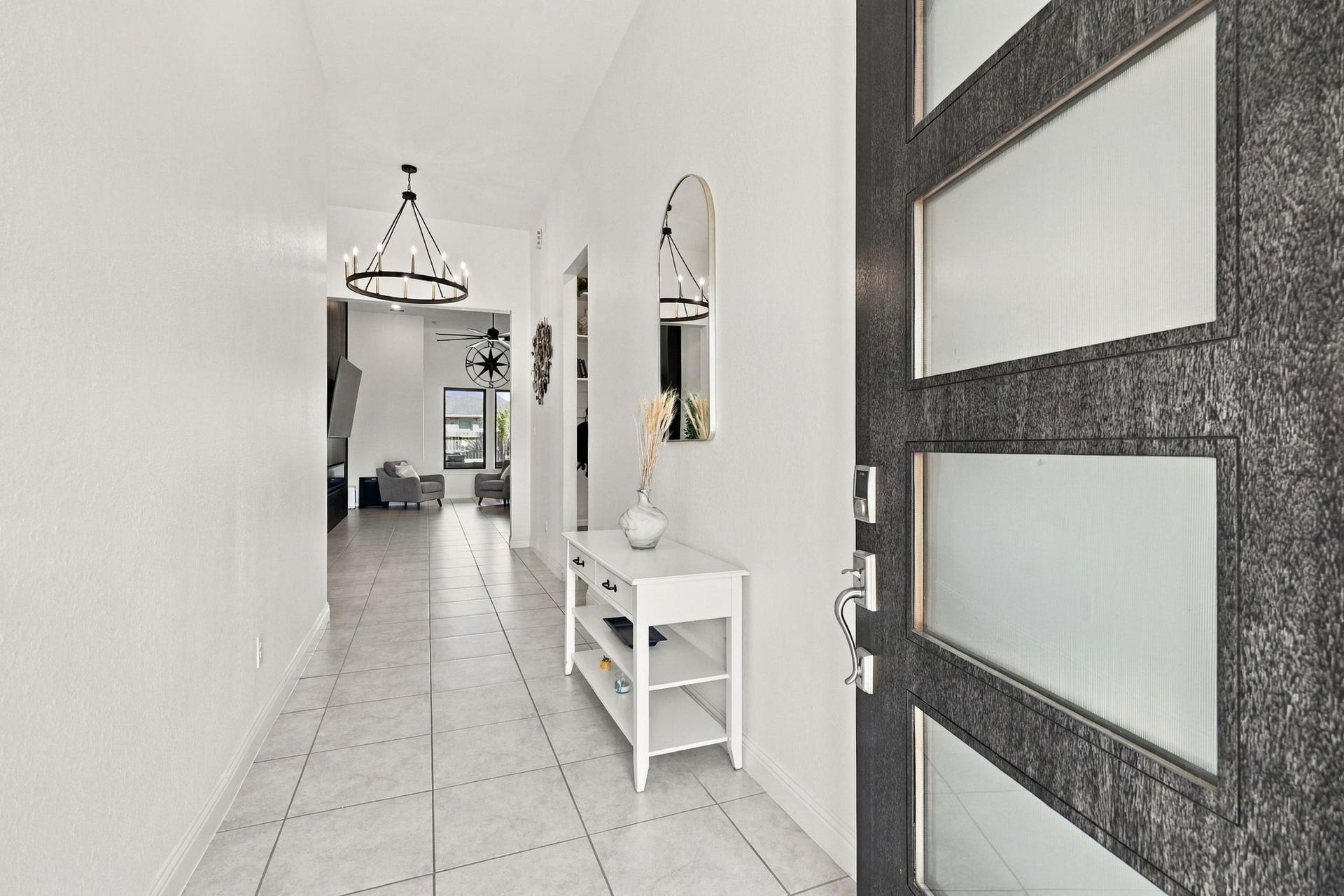 Upon entering, you're welcomed by soaring ceilings, an open atmosphere, and elegant architectural details.