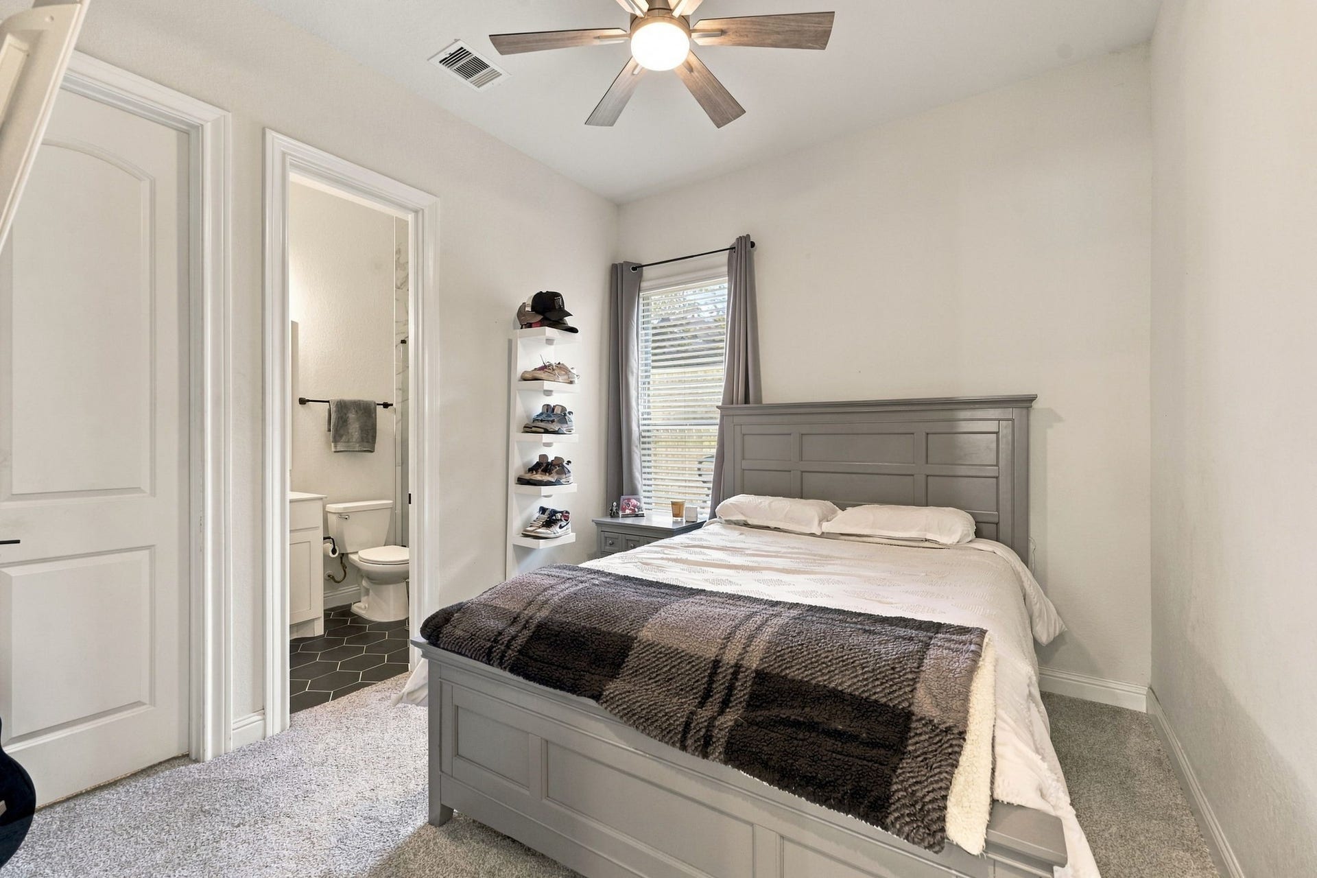 The first secondary bedroom offers a comfortable layout, natural light, a full bath, and space to make it your own.