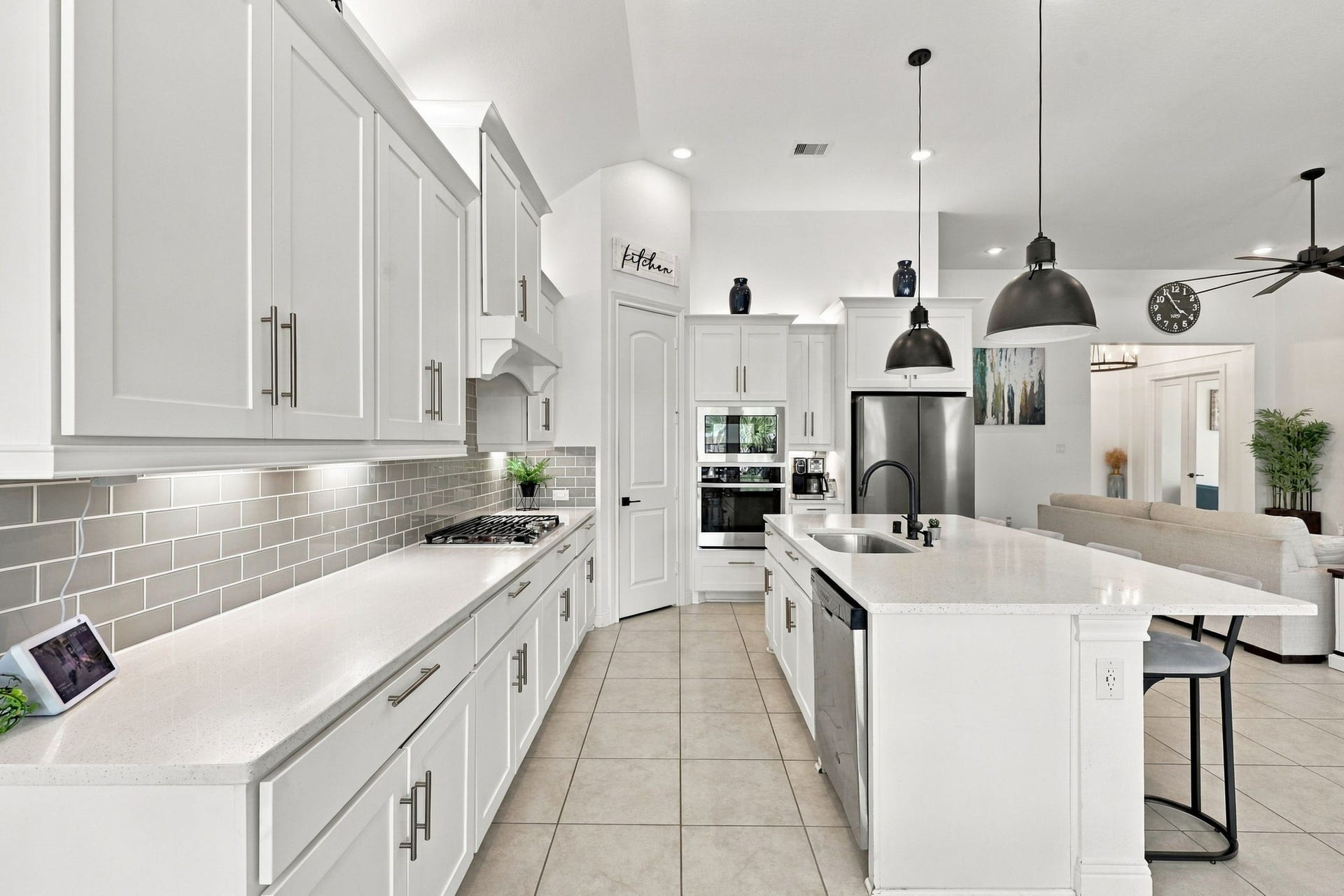 Notice the thoughtfully added cabinentry, providing even more storage and functionality to this beautiful kitchen.